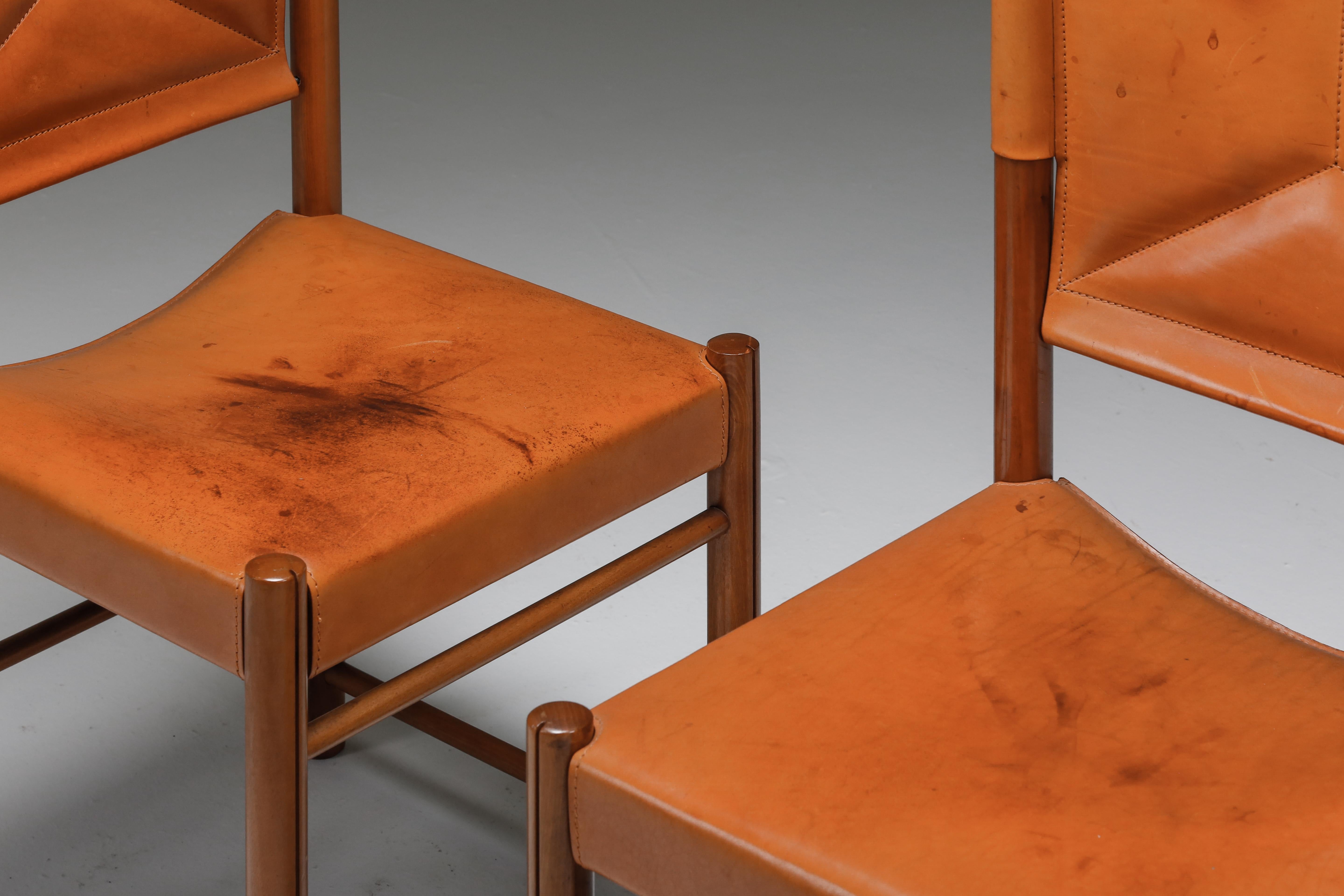 Cognac leather chairs, attributed to Carlo Scarpa, Italy, 1960s

Cognac leather chairs, attributed to Carlo Scarpa, made in Italy, 1960s. Carlo Scarpa attributed dining chairs in beautifully aged natural saddle leather, and a solid walnut frame.