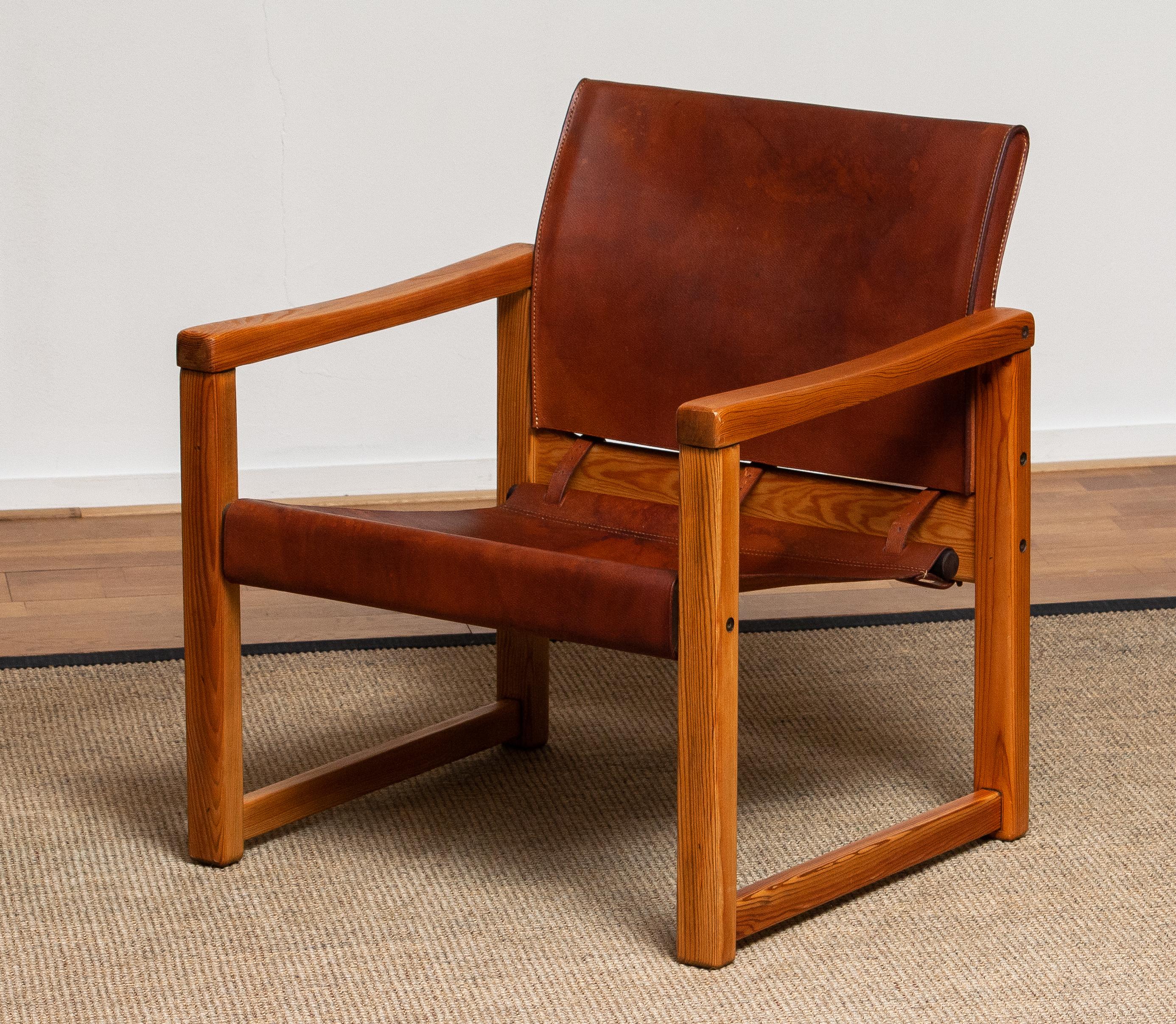 Beautiful leather safari chair (Model Diana) designed by Karin Mobring for Ikea Sweden. The model is lounged in 1974.
The study cognac leather is in good and smooth condition and also has a beautiful patina true the years. Overall condition of the