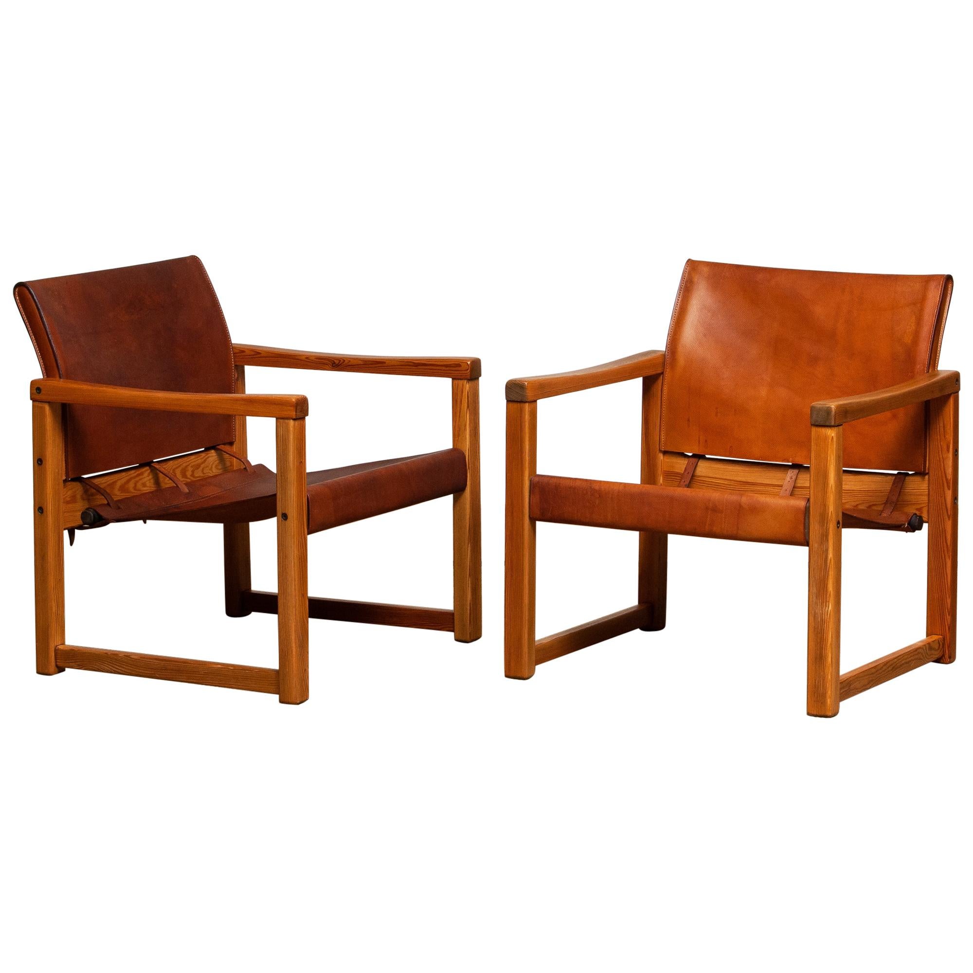 Beautiful set of two study cognac leather safari chairs (Model Diana) designed by Karin Mobring for Ikea, Sweden. The model is lounged in 1974.
The leather on both chairs is in good and smooth condition and also has a beautiful patina true the