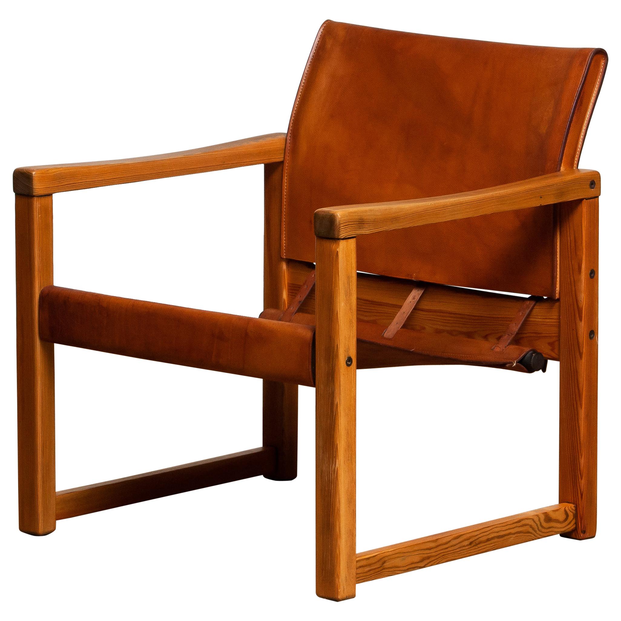 Beautiful leather safari chair (Model Diana) designed by Karin Mobring for Ikea, Sweden. The model is lounged in 1974.
The study cognac leather is in good and smooth condition and also has a beautiful patina true the years. Overall condition of the