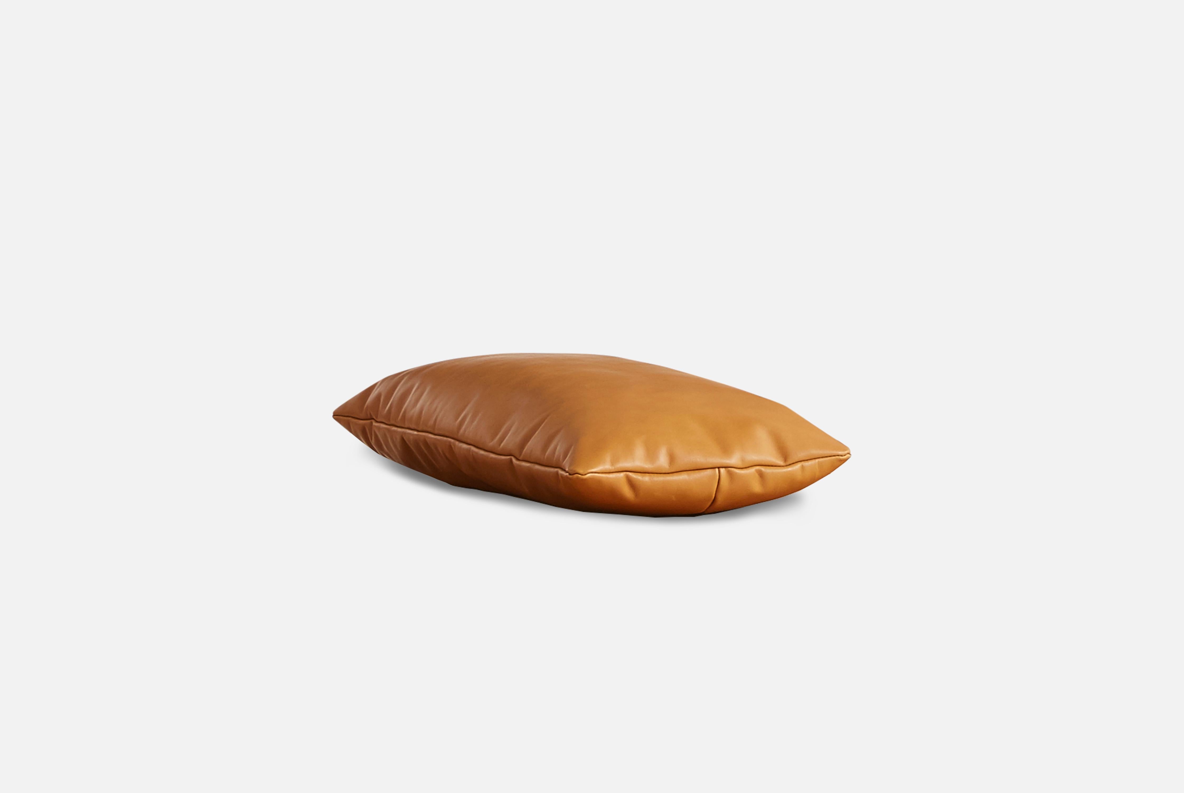 Cognac leather level pillow by Msds Studio
Materials: Camo Leather, Fabric
Dimensions: D 23.5 x W 67 x H 8.5 cm

The founders, Mia and Torben Koed, decided to put their 30 years of experience into a new project. It was time for a change and a