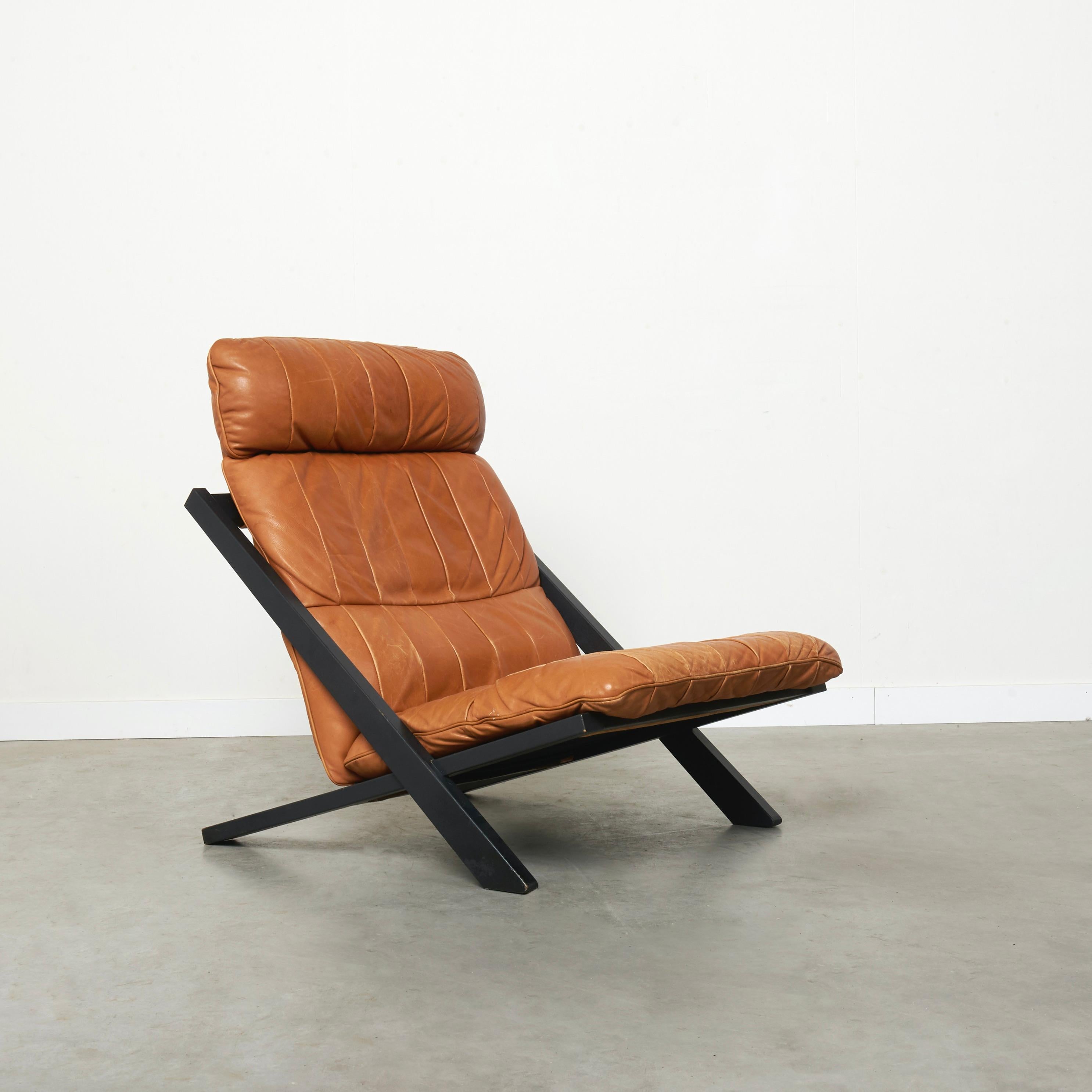 De Sede lounge chair, model DS80. Designed by Ueli Berger, 1970s.
Cognac leather patchwork upholstery with black wooden frame.
Chair is in very good condition. Leather with nice patina.