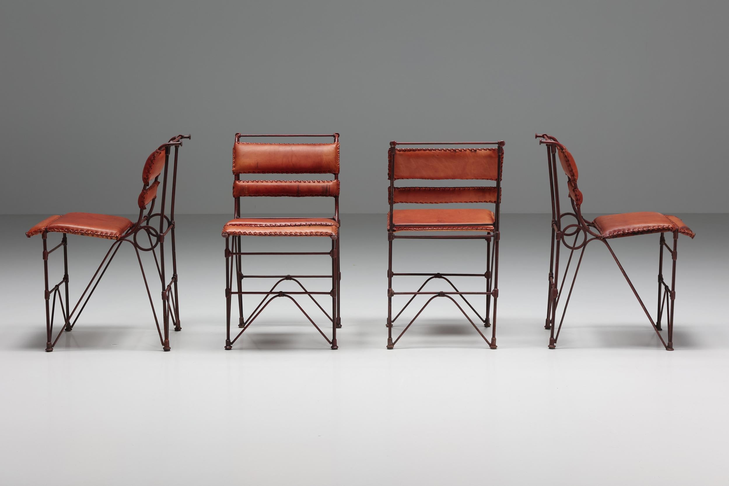 A remarkable set of four dining chairs in excellent condition. The organic steel frame goes hand in hand with the timeless cognac leather seating and back support. A very playful and organic design, yet it is very comfortable which makes it an ideal
