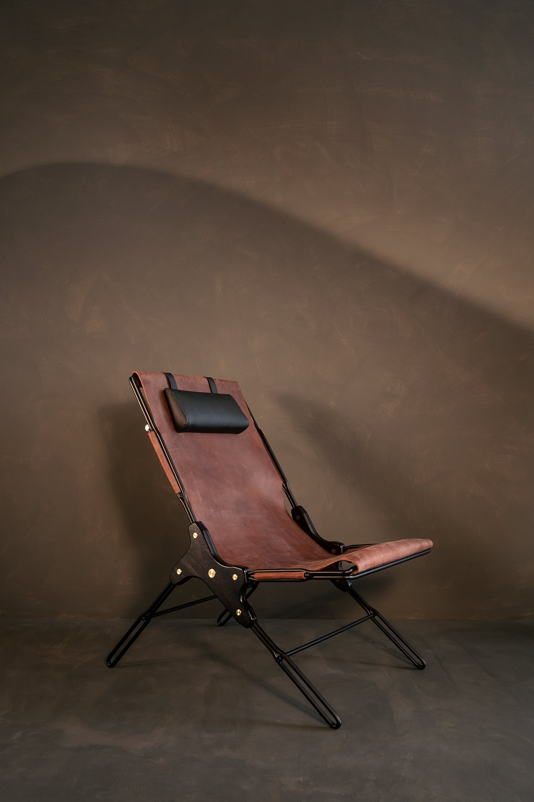 Cognac lounge chair by Estudio Andean 
Dimensions: W 56 x D 83 x H 93 cm
Materials: steel, bronze, wood, leather.

Lounge chair made of steel rod structure and solid colorado wood with a natural oil finish, Ecuadorian sustainable cowhide leather