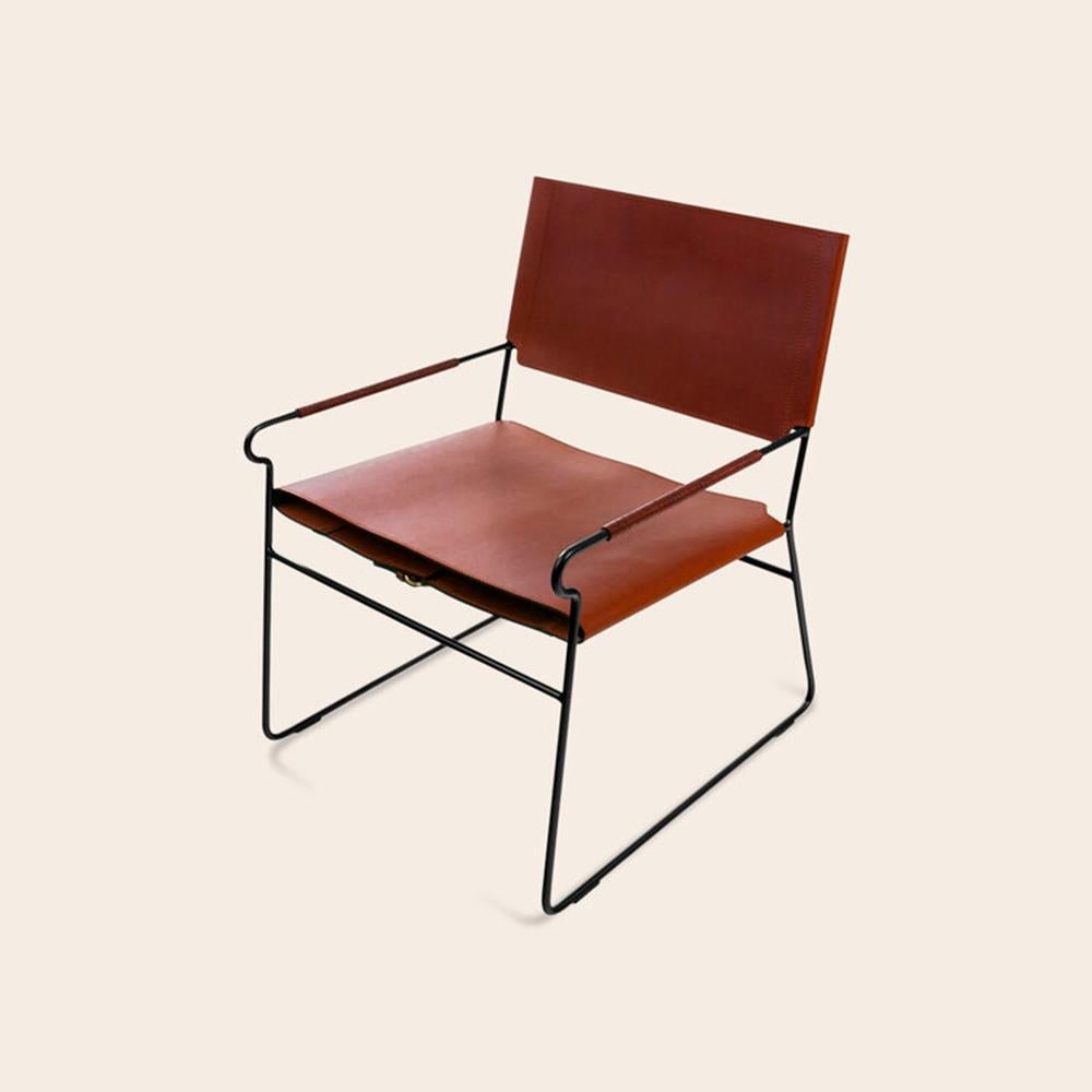 Cognac Next Rest chair by OxDenmarq
Dimensions: D 66 x W 60 x H 77 cm
Materials: Leather, Black Powder Coated Steel
Also Available: Different leather colors available.

OX DENMARQ is a Danish design brand aspiring to make beautiful handmade