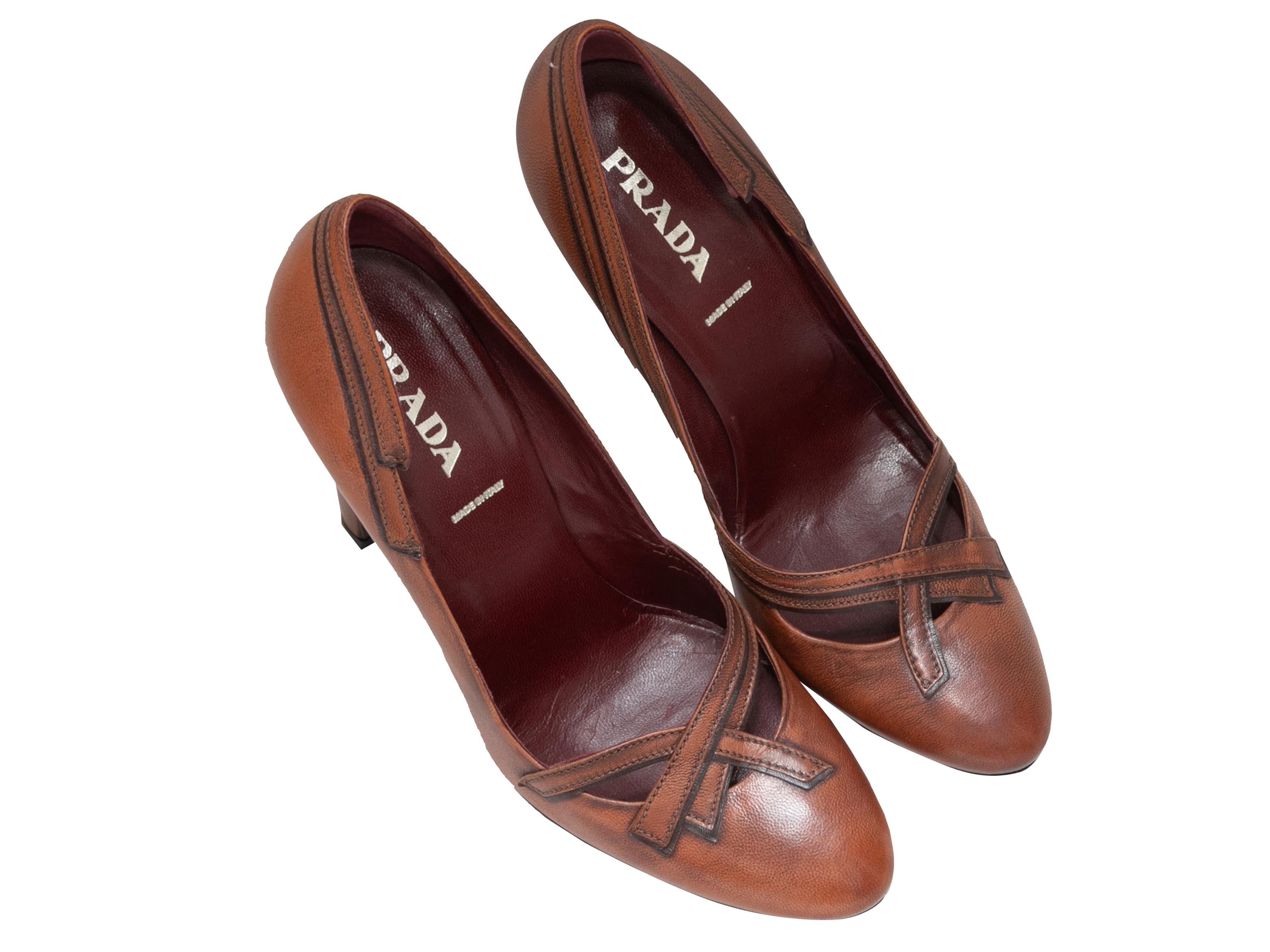  Cognac leather cutout pumps by Prada. Cutouts at toes. 4.25