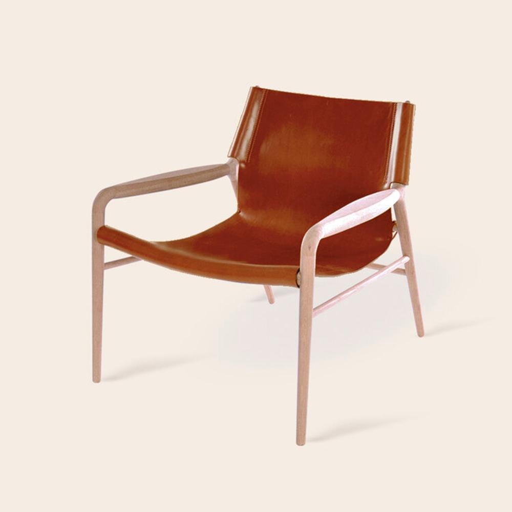 Cognac Rama oak chair by Ox Denmarq.
Dimensions: D 72 x W 68 x H 70 cm.
Materials: leather, wood
Also available: different colors available.

Ox Denmarq is a Danish design brand aspiring to make beautiful handmade furniture, accessories and
