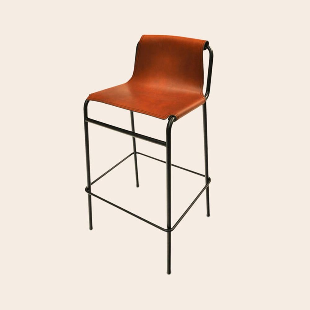 Cognac September Bar Stool by OxDenmarq
Dimensions: D 38 x W 42 x H 93 cm
Materials: Leather, Black Powder Coated Steel
Also Available: Different colors available,

OX DENMARQ is a Danish design brand aspiring to make beautiful handmade