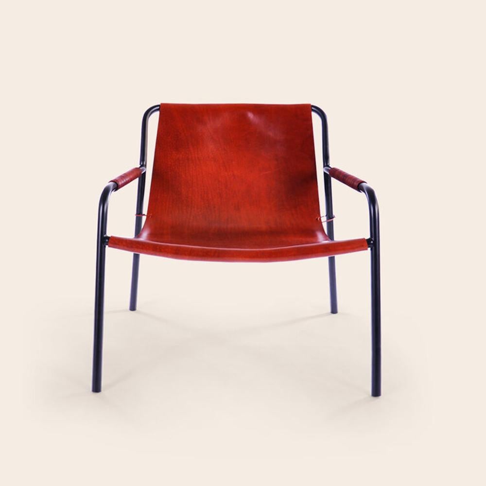 Cognac september chair by Ox Denmarq
Dimensions: D 71 x W 71 x H 70 cm
Materials: bull leather, black powder coated steel
Also available: different leather colors available.

Ox Denmarq is a Danish design brand aspiring to make beautiful