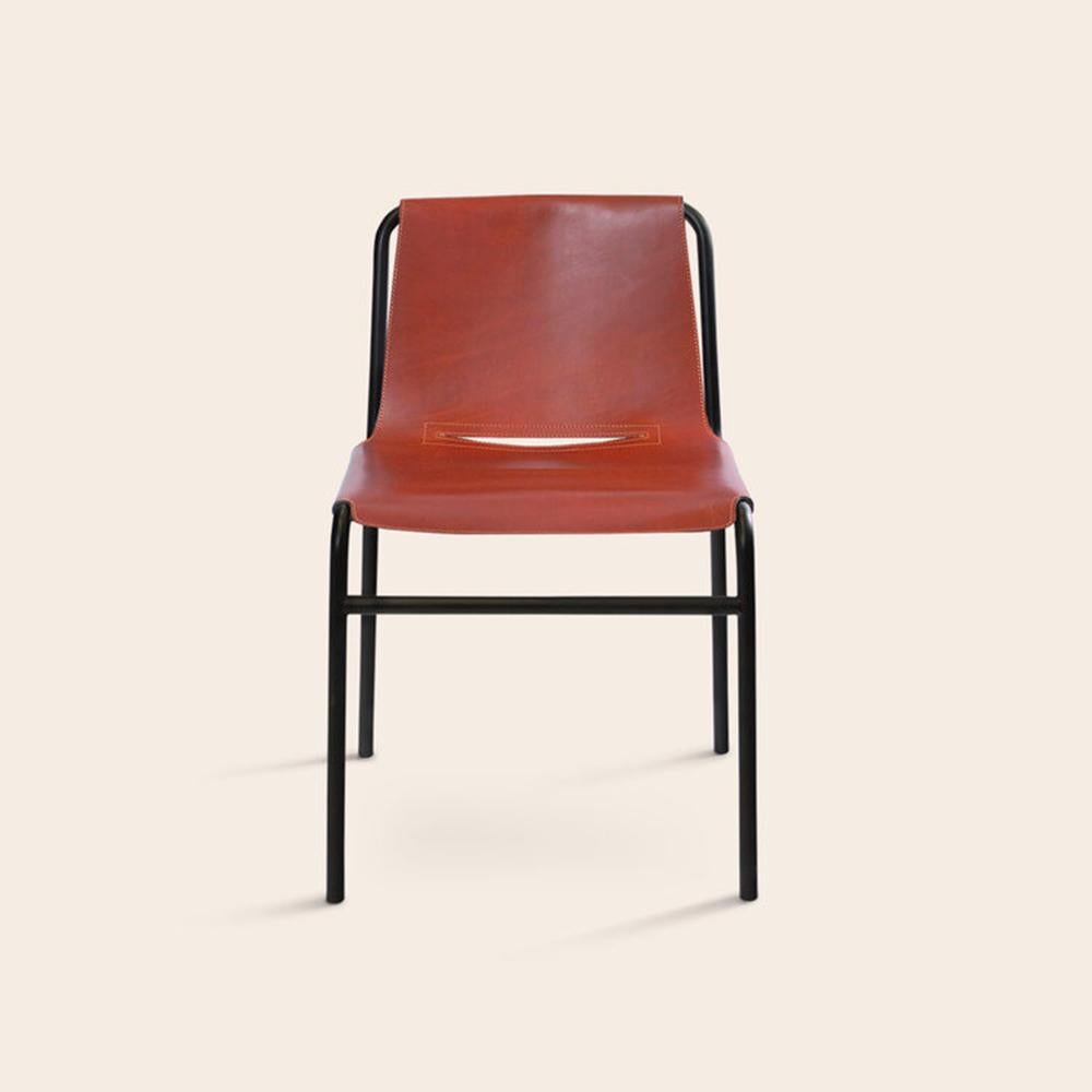 Cognac September dining chair by Ox Denmarq
Dimensions: D 54 x W 48 x H 80 cm
Materials: leather, black powder coated steel
also available: different colors available.

Ox Denmarq is a Danish design brand aspiring to make beautiful handmade