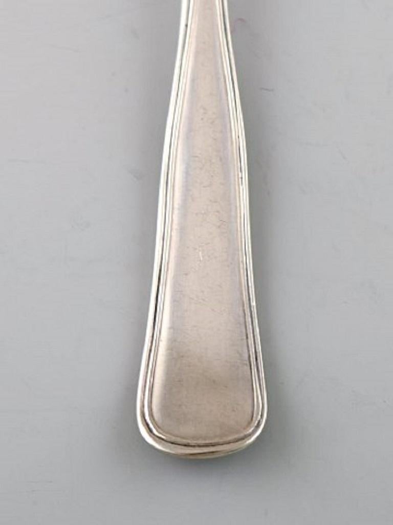 Cohr cake fork, Old Danish silver cutlery, 1920s-1930s.
8 pieces, in stock.
Measures: 14.5 cm.
Stamped: CMC.
In very good condition.