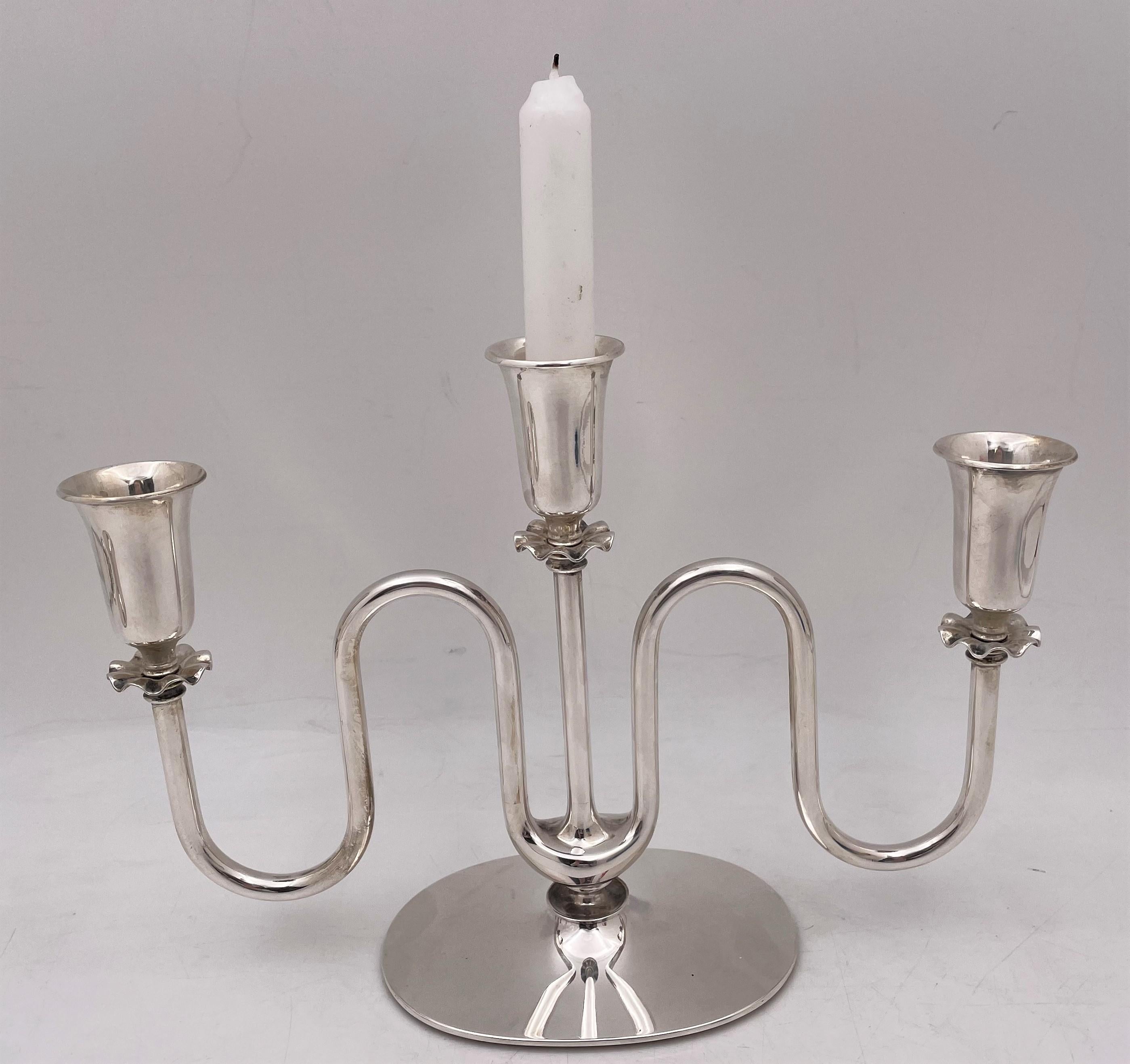 Cohr, Danish, sterling silver pair of 3-light (oil) candelabra in Mid-Century Modern style with an exquisite flowing design, measuring 11'' in length by 7 1/2'' in height by 3 1/2'' in depth, weighing 27.3 troy ounces, and bearing hallmarks as