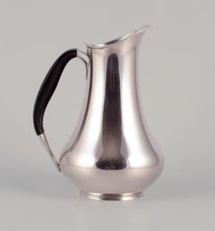 Cohr, Denmark. Pitcher in 830 silver. Handle made of precious wood.