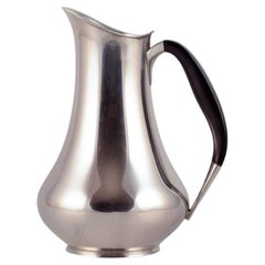 Cohr, Denmark. Pitcher in 830 silver. Handle made of precious wood.