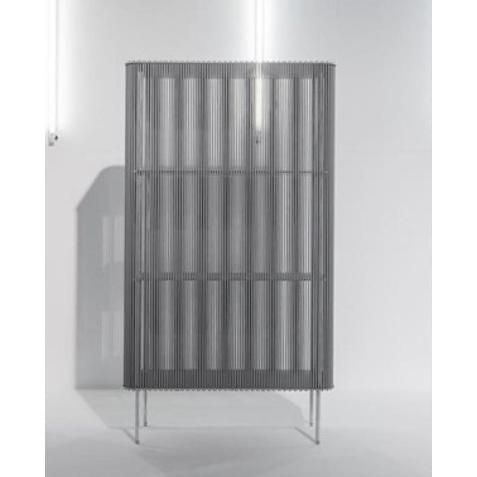 Coil #3 low cabinet by Bram Kerkhofs
Dimensions: D80 x W40 x H144.5 cm
Materials: Stainless steel, aluminum, elastic rope (natural rubber, polyethylene).

Other dimensions are available.

Coil is a modular cabinet system in which the ‘shell’