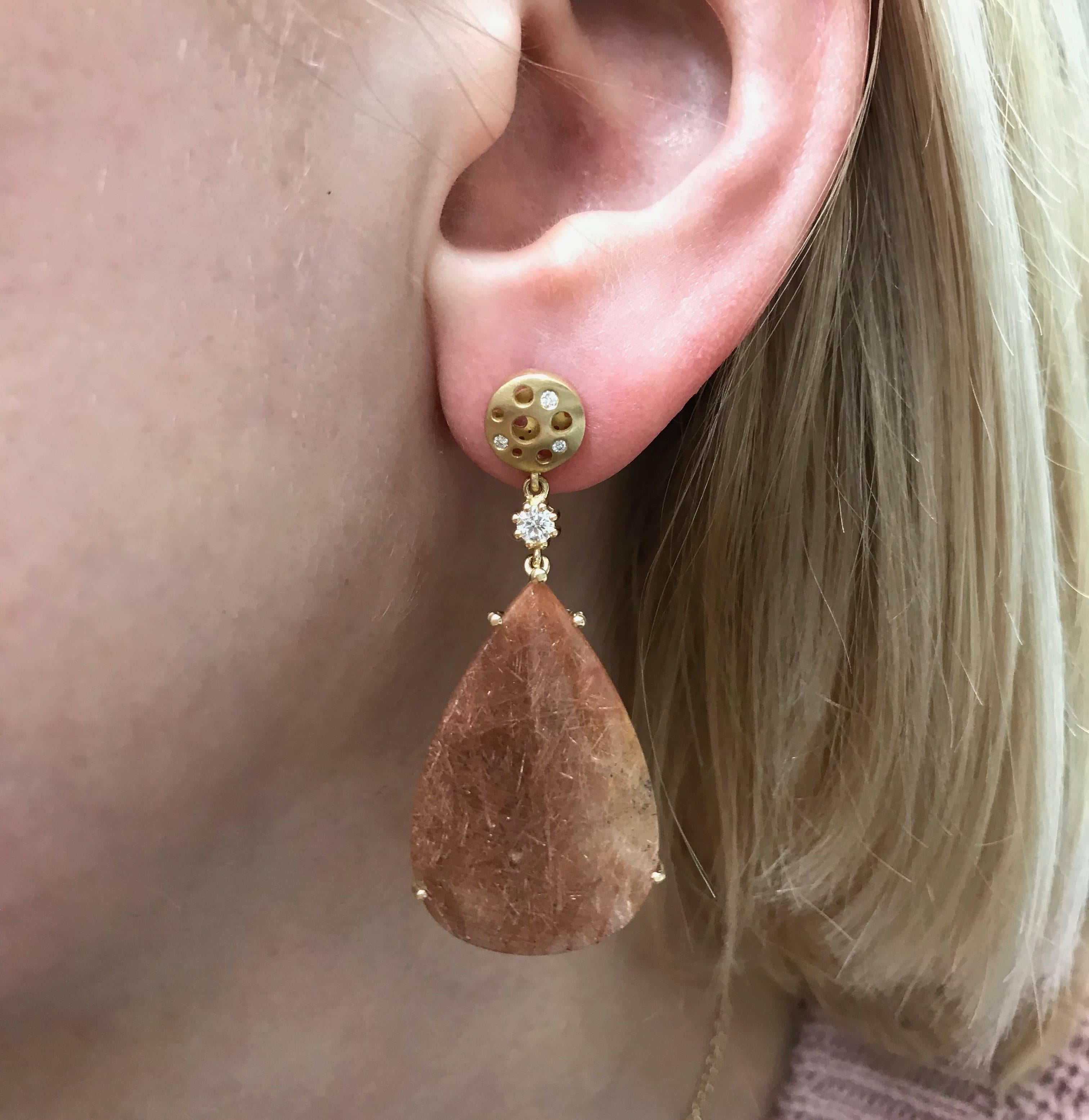 This redish, pinkish, slightly translucent rutilated quartz pair was so beautiful, they were screaming to become a pair of drop earrings. I chose to leave the design simple in the front to compliment the breathtaking beauty of these quartzes, whose