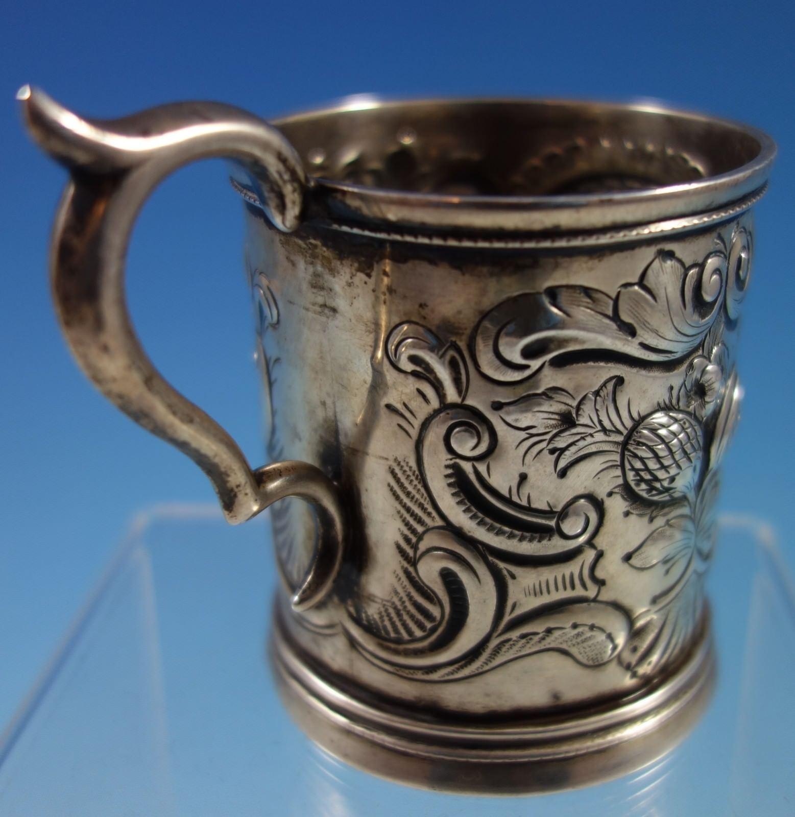 Coin silver baby cup. The cup has exquisite repoussed fruit and scrollwork and vintage monogram that reads daisy (see photos). The cup measures 3 1/2 x 4. It is in good vintage condition. Beautiful! 




