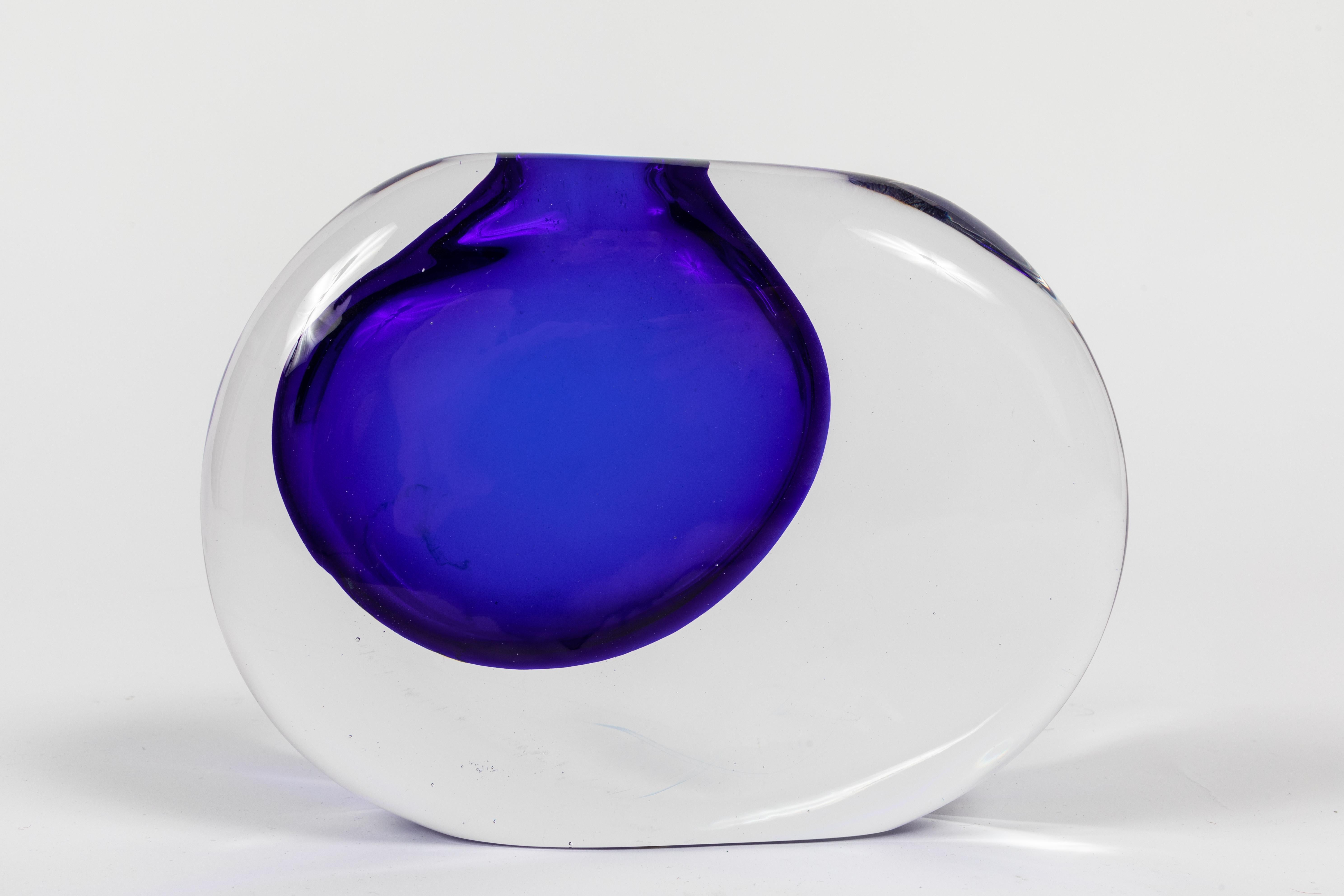 A striking example of the Sasso this one in clear glass with a dramatic infusion of Cobalt blue. Designed by Antonio da Ros and made by the Murano glass house Cenedese.
 