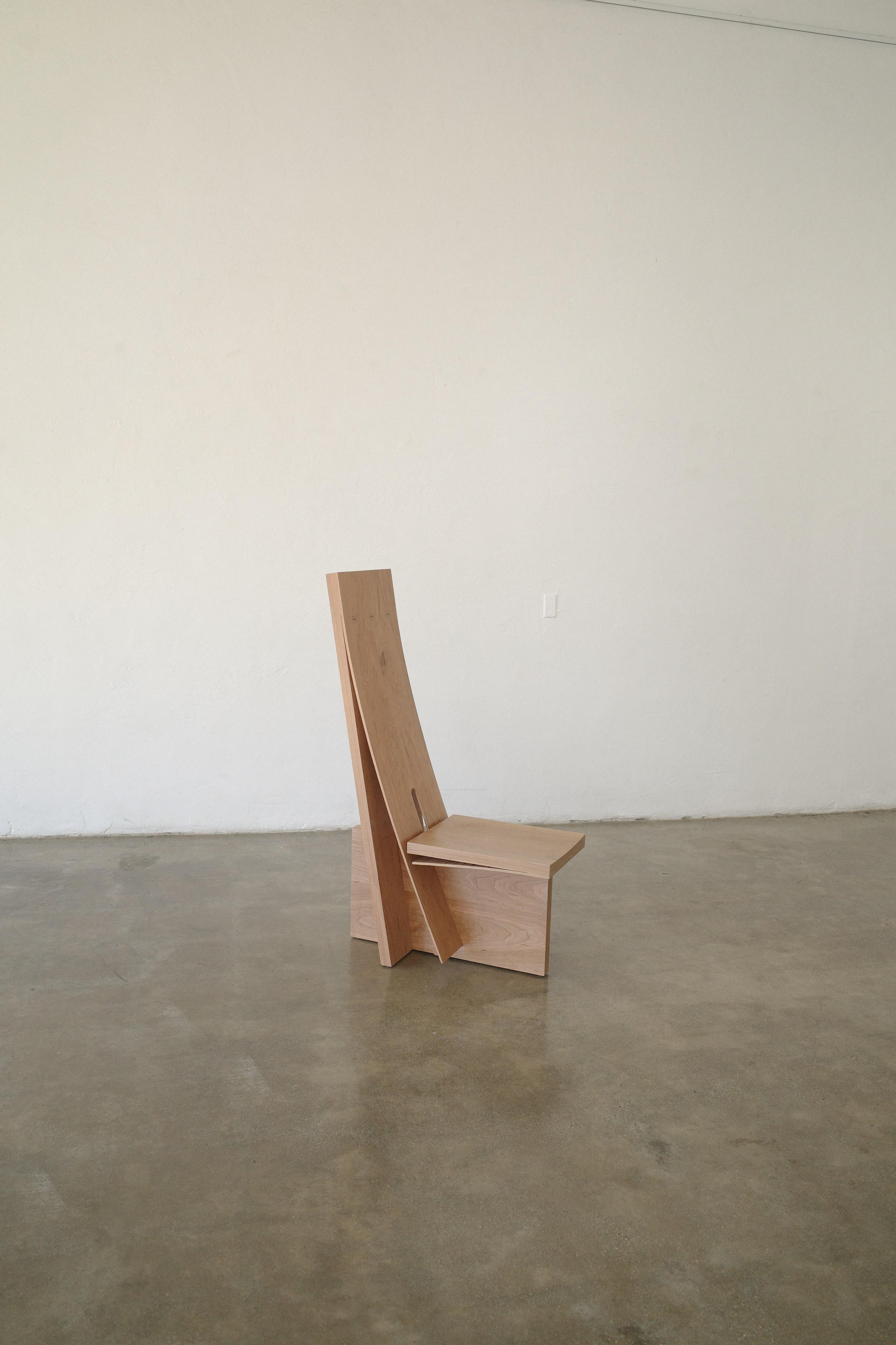 Cold bent chair by Nick Pourfard
Dimensions: D 61 x W 41 x H 102 cm.
Materials: wood.
Different finishes available.

Wood is bent without steam or lamination, playing advantage to tension and memory built into the wood naturally.

Nicholas