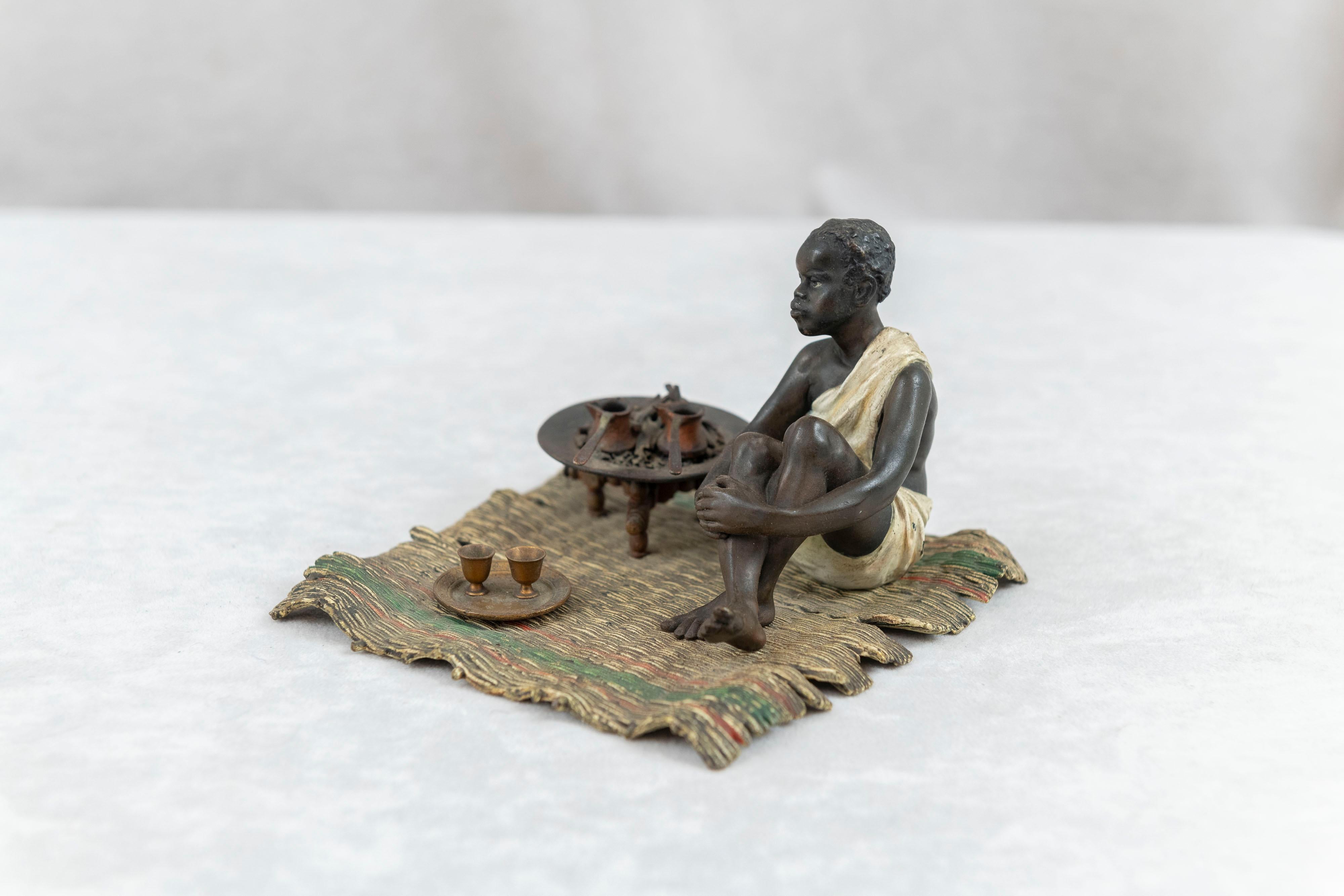 20th Century Cold Painted Austrian Orientalist Seated Young Boy Cooking, Bergmann Foundry For Sale