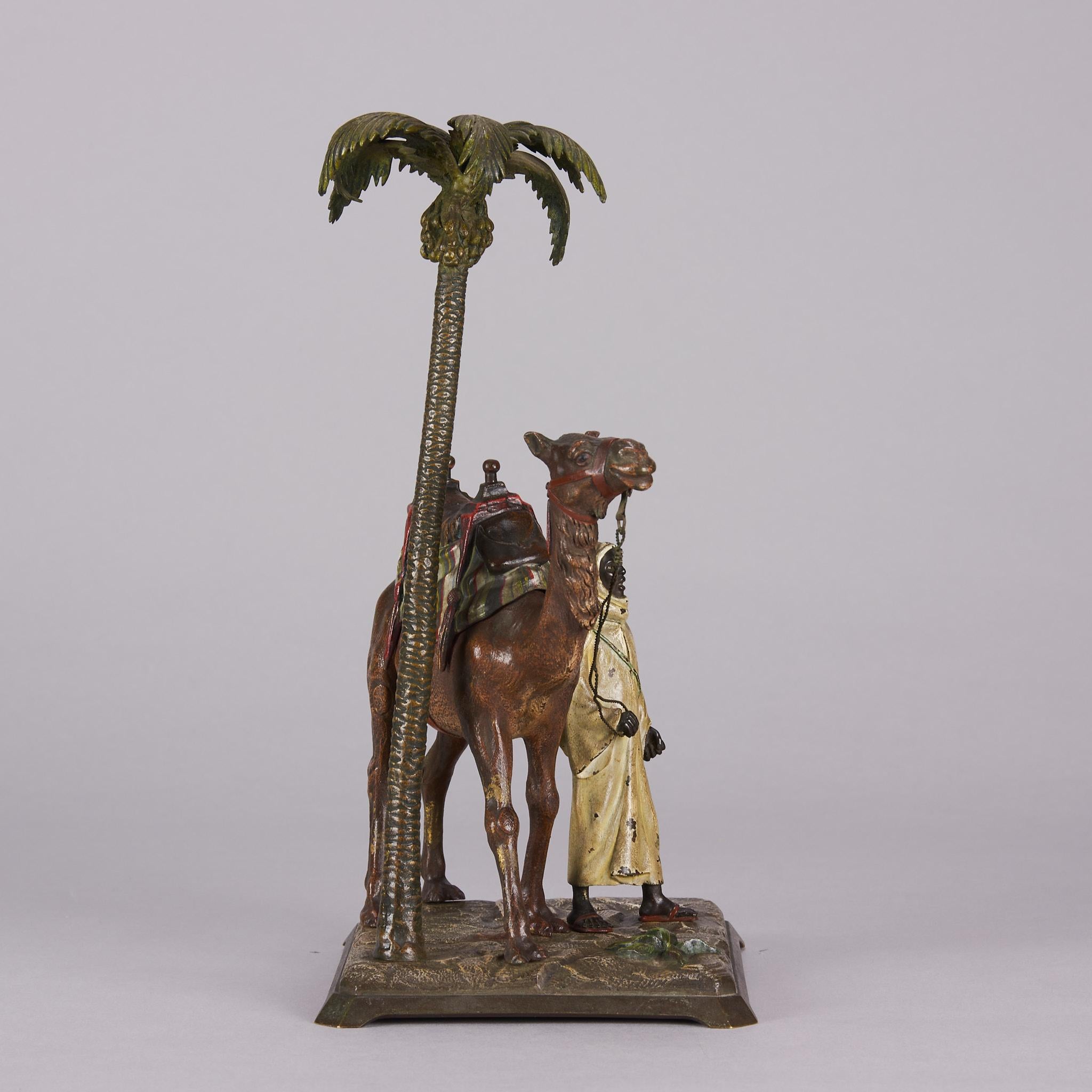 Moulage Bronze peint à froid intitulé « Bedouin with Camel under Palm Tree » (Bedouin avec camel sous palmier) par Bergman en vente