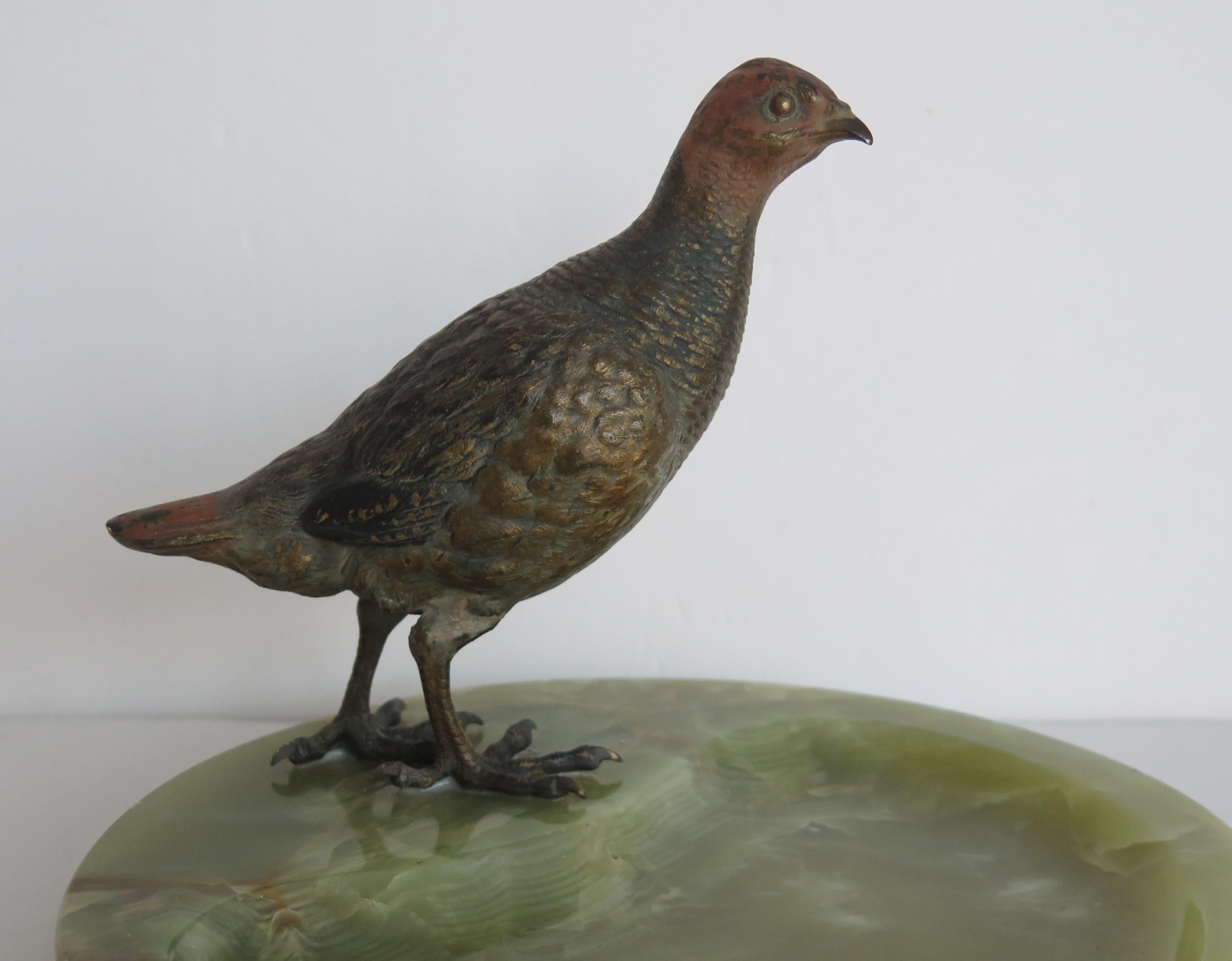 This is a very good bronze sculpture of a Grey Partridge, stood on an Onyx stone tray base, all dating to the Art Deco period, Circa 1930.

The bronze Partridge is very well modelled with good quality cold hand painted detail, that has not been