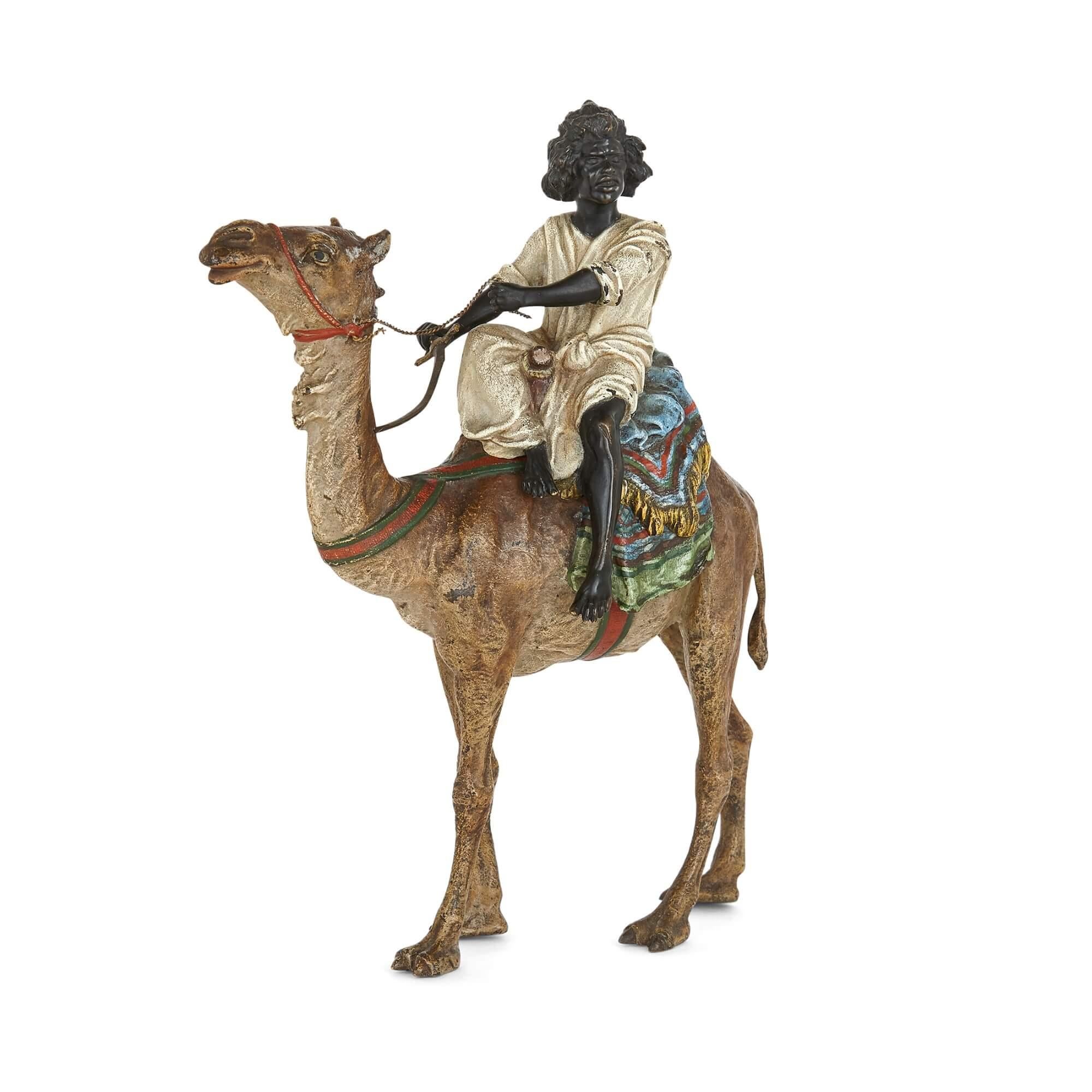 Cold-painted bronze of a camel by Franz Xaver Bergman
Austrian, c. 1910
Measures: Height 21cm, width 18cm, depth 7cm

This bronze sculpture of a camel and its rider epitomises the very best of Bergman. The camel is a superb piece of animalier