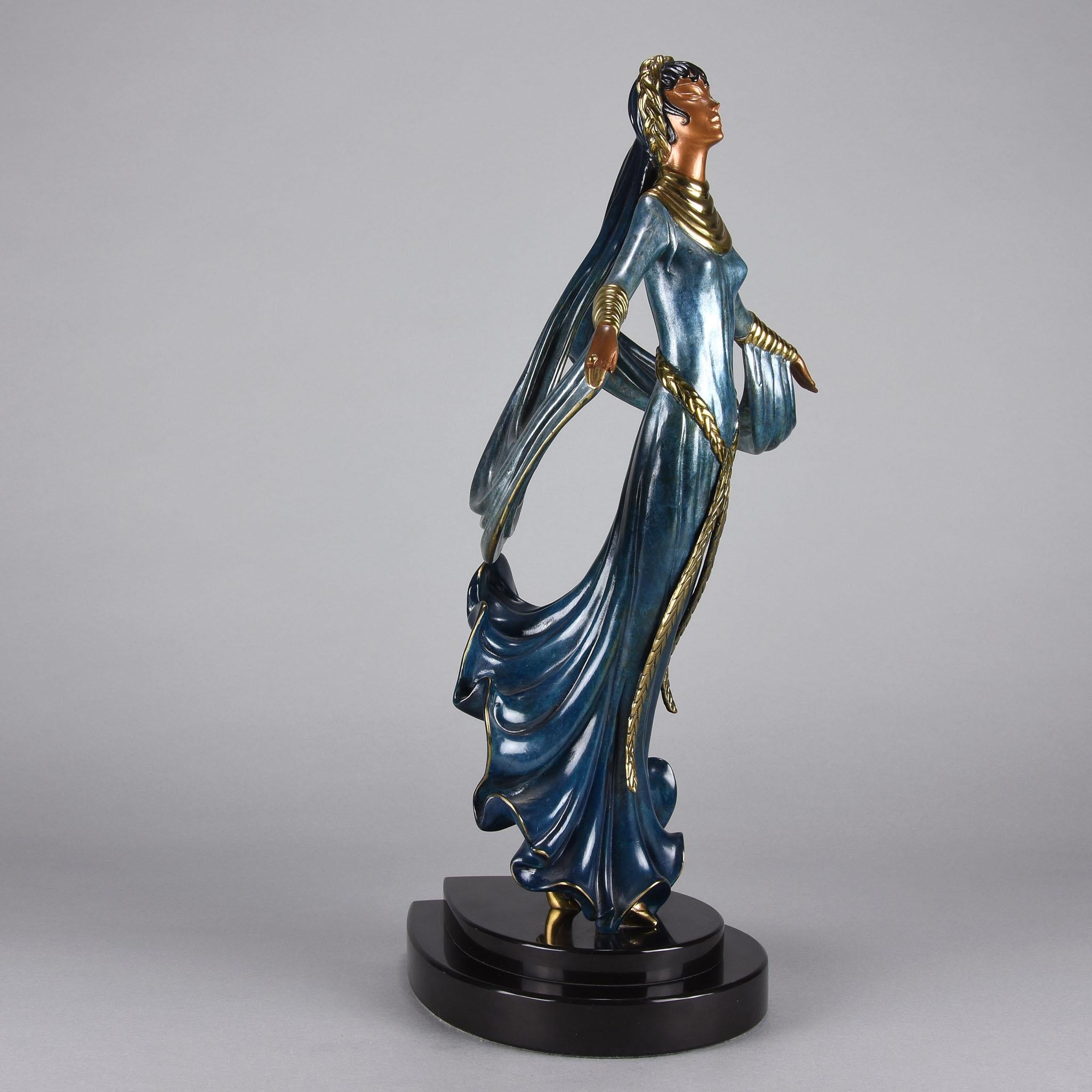 A fabulous limited edition Art Deco bronze of a beautiful young woman in elegant dress with vivid enamel colour highlighted with gilt bronze plaited headband and belt. The figure raised on an integral stepped plinth. Signed Erté, dated 1989,