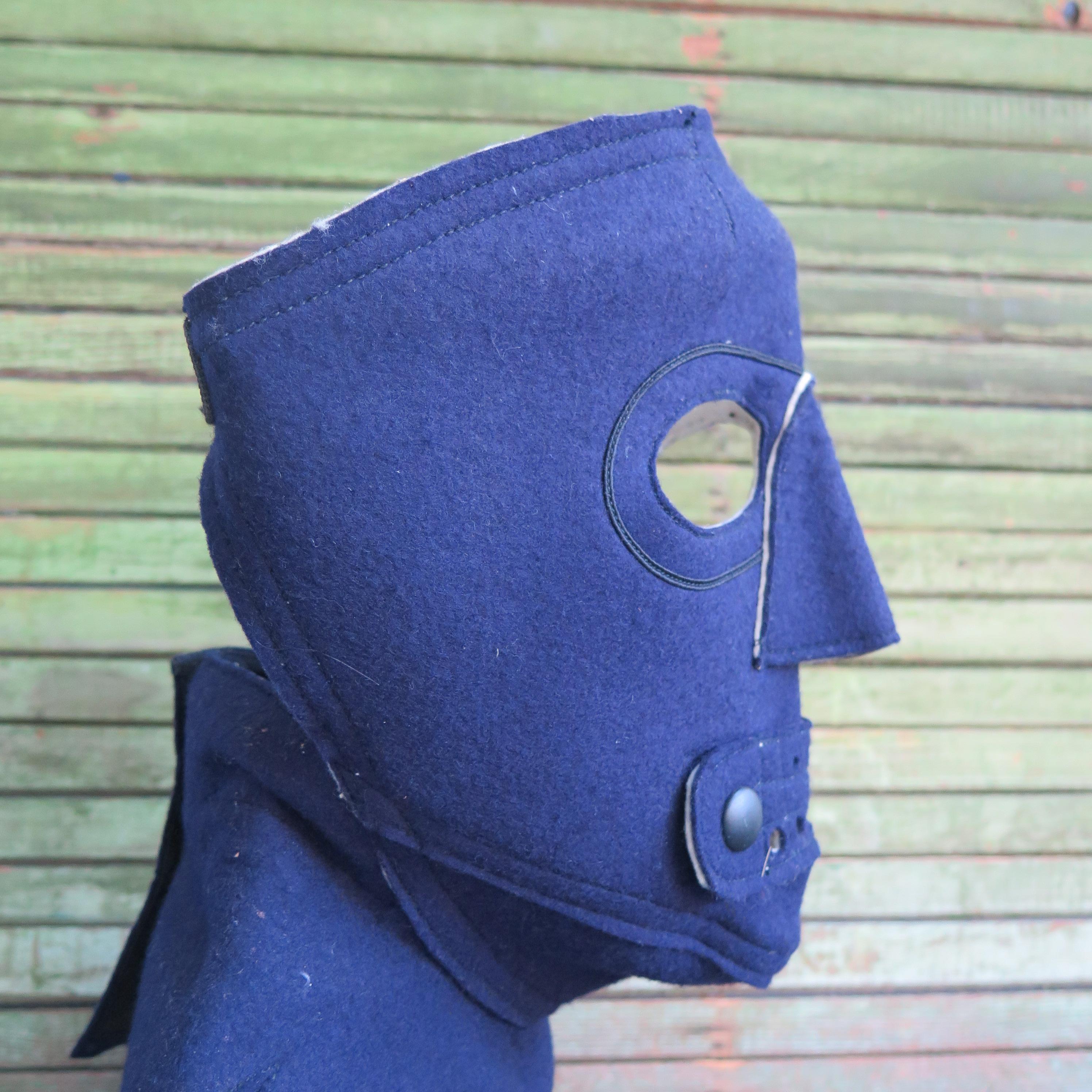 Mask made for face protection from cold at higher altitudes. A similar mask was loaned to the Museum of Modern Art for exhibition Modern Masks and Helmets some years ago. This type of felt mask was designed and made for the Navy with flap opening