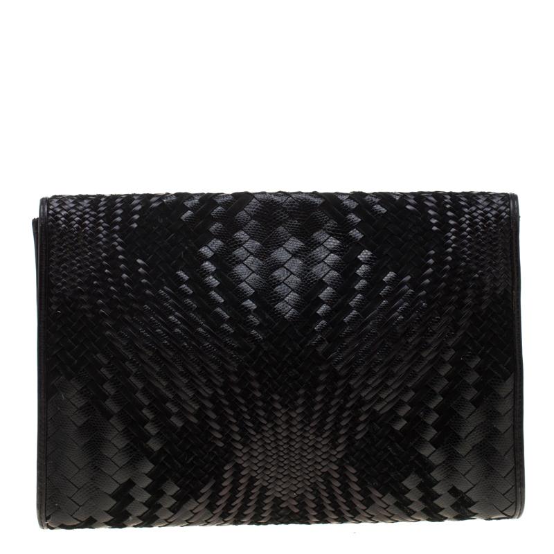 An expert style of craftsmanship was used to create this Cole Haan clutch. As evident, leather and suede is woven to form the exterior into a rectangular shape. The interior is lined with fabric and secured by a flap.

Includes: The Luxury Closet