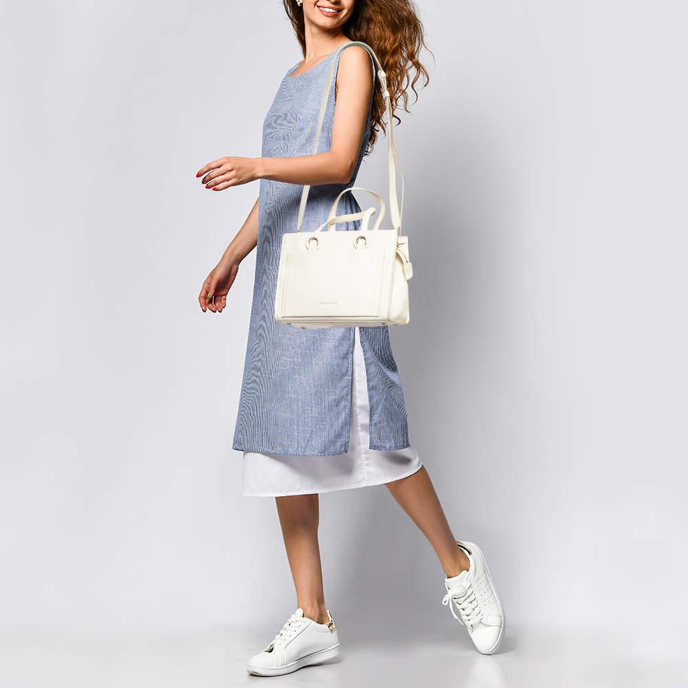 This alluring tote bag for women has been designed to assist you on any day. Convenient to carry and fashionably designed  the tote is cut with skill and sewn into a great shape. It is well equipped to be a reliable accessory.
