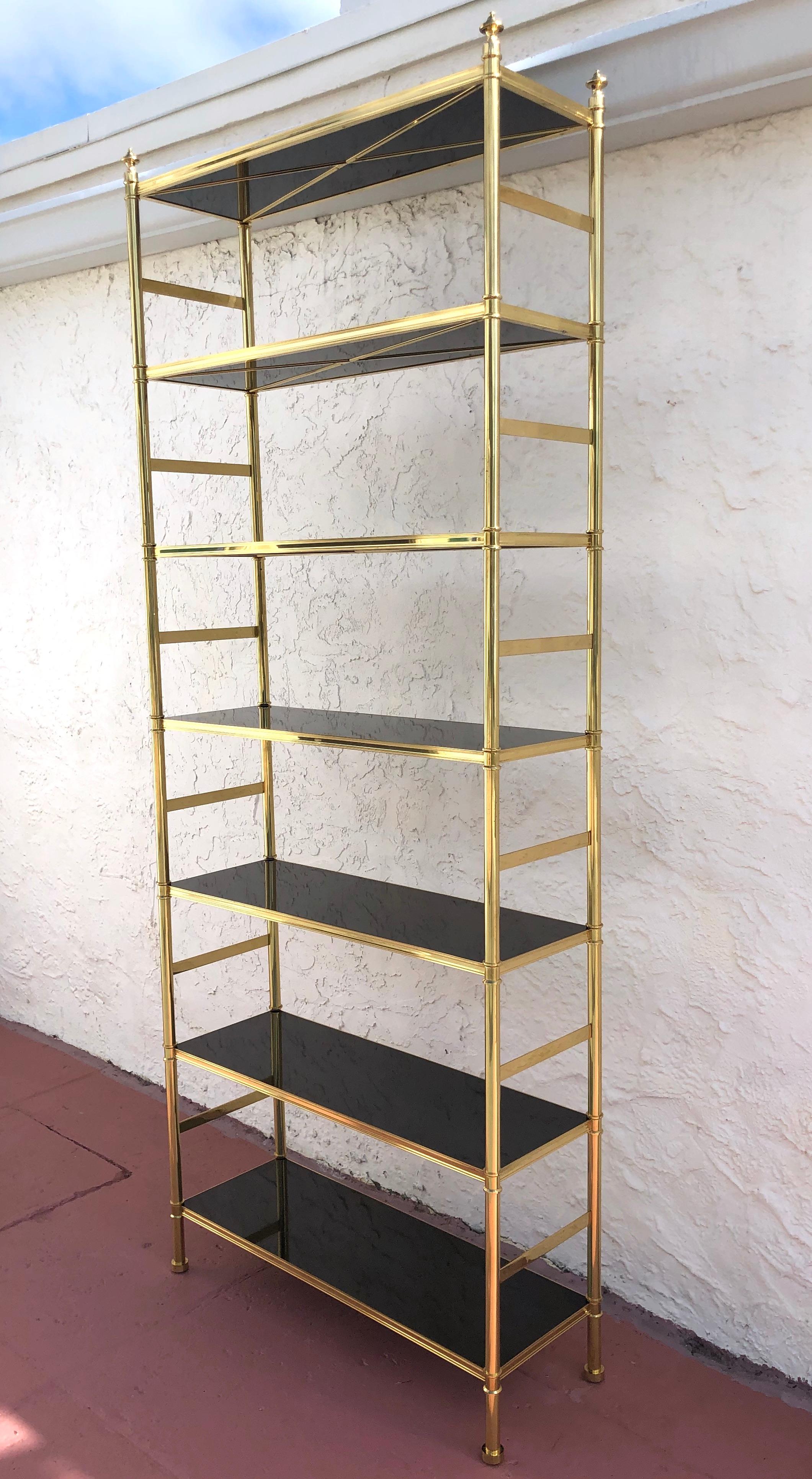The Cole porter étagère/ bookcase, designed by Frederick Victoria, circa 1954, for Billy Baldwin and Cole porter. An exceptional custom order, 7-tiered black lacquered shelves with brass 