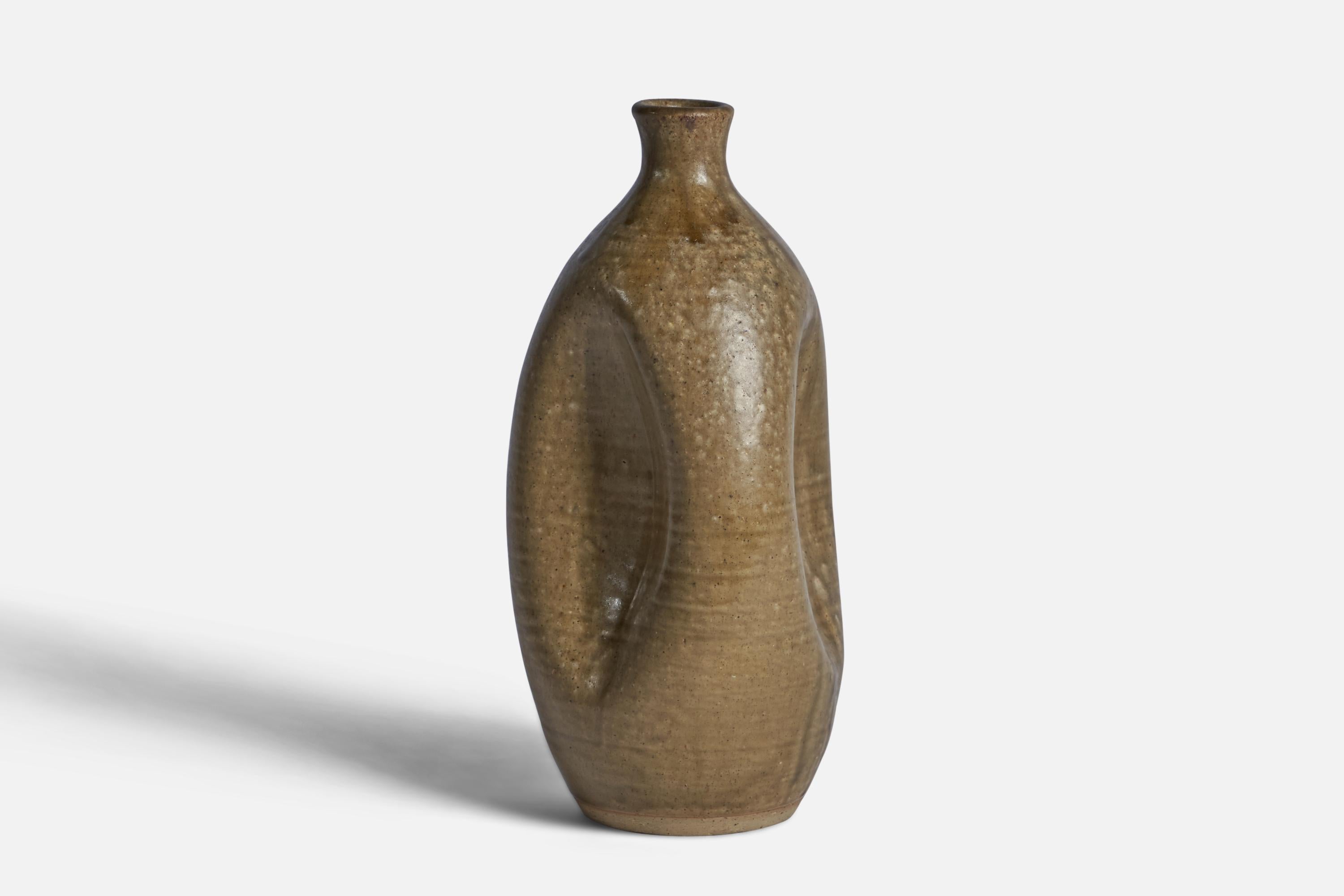 A brown-glazed earthenware 