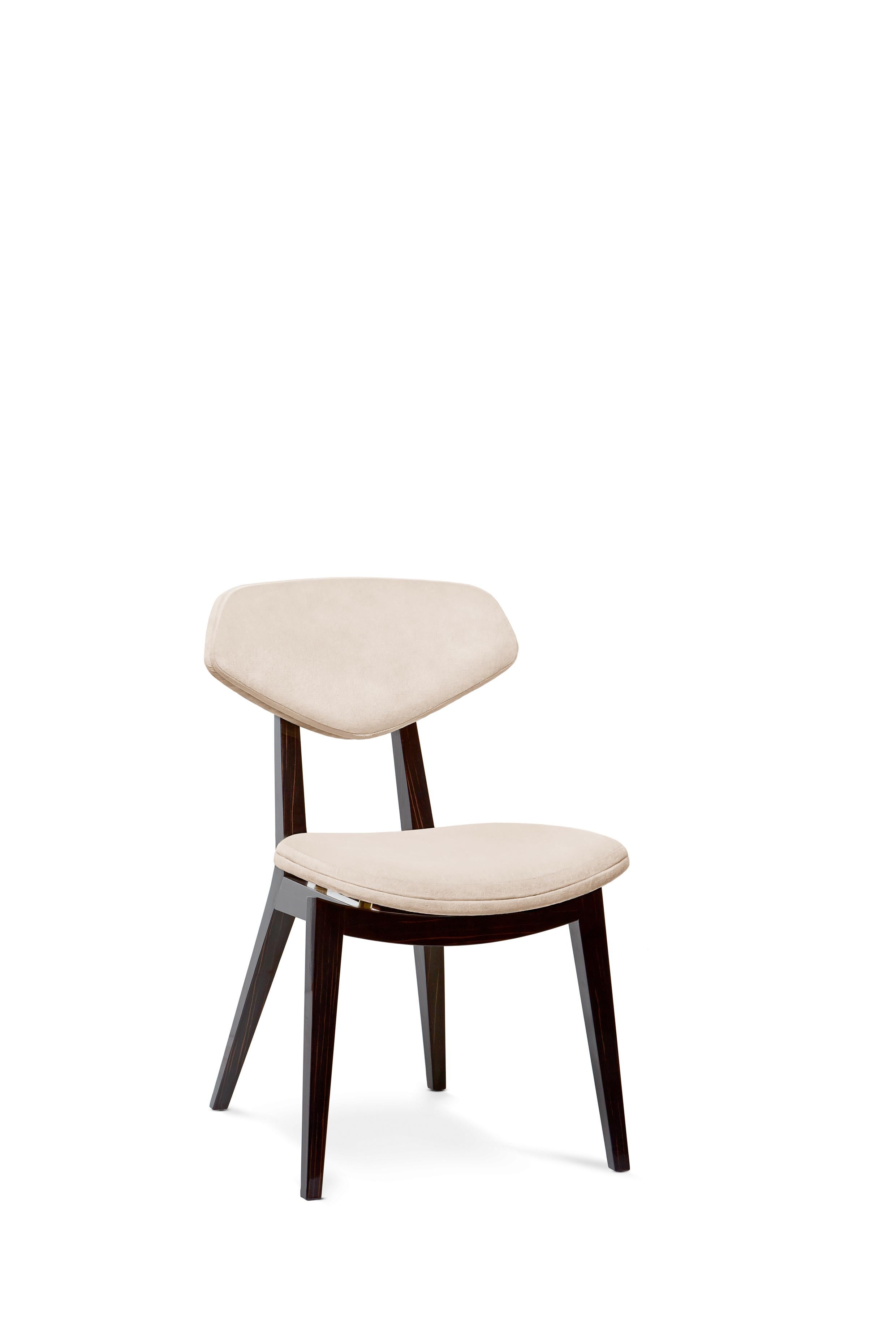 Coleman Chair by Munna
Dimensions: D 63 x W 48 x H 81 cm. SH: 49 cm.
Materials: Wood, foam, brass, and upholstery.
Finish: Trevira Velvet, ref. Magnolia, TRV01 upholstery, ebony wood veneer finished with gloss varnish and brushed brass. 

Available