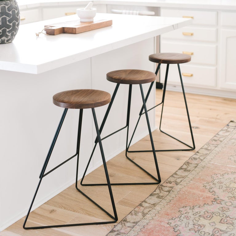 The Coleman stool is a sophisticated design that blends mixed materials, color, and geometry to create a distinctive seating option. First released in 2010, it was awarded a Best Furniture Award from the 2015 Dwell on Design Awards. Each stool is