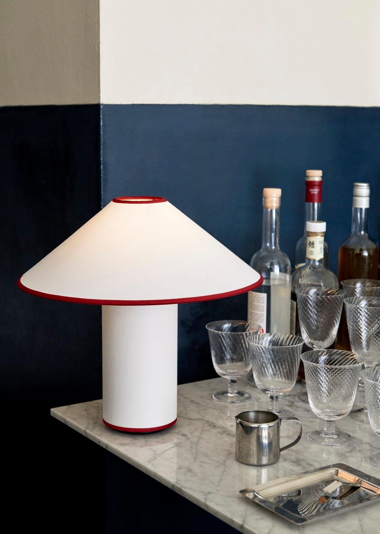 Named after the famed and pioneering French author known simply as ‘Colette’, &Tradition’s new table lamp has an avant-garde aesthetic. Showcasing a tactile shade and base fully encased in a crisp, off-white cotton-linen blend, this dimmable lamp is