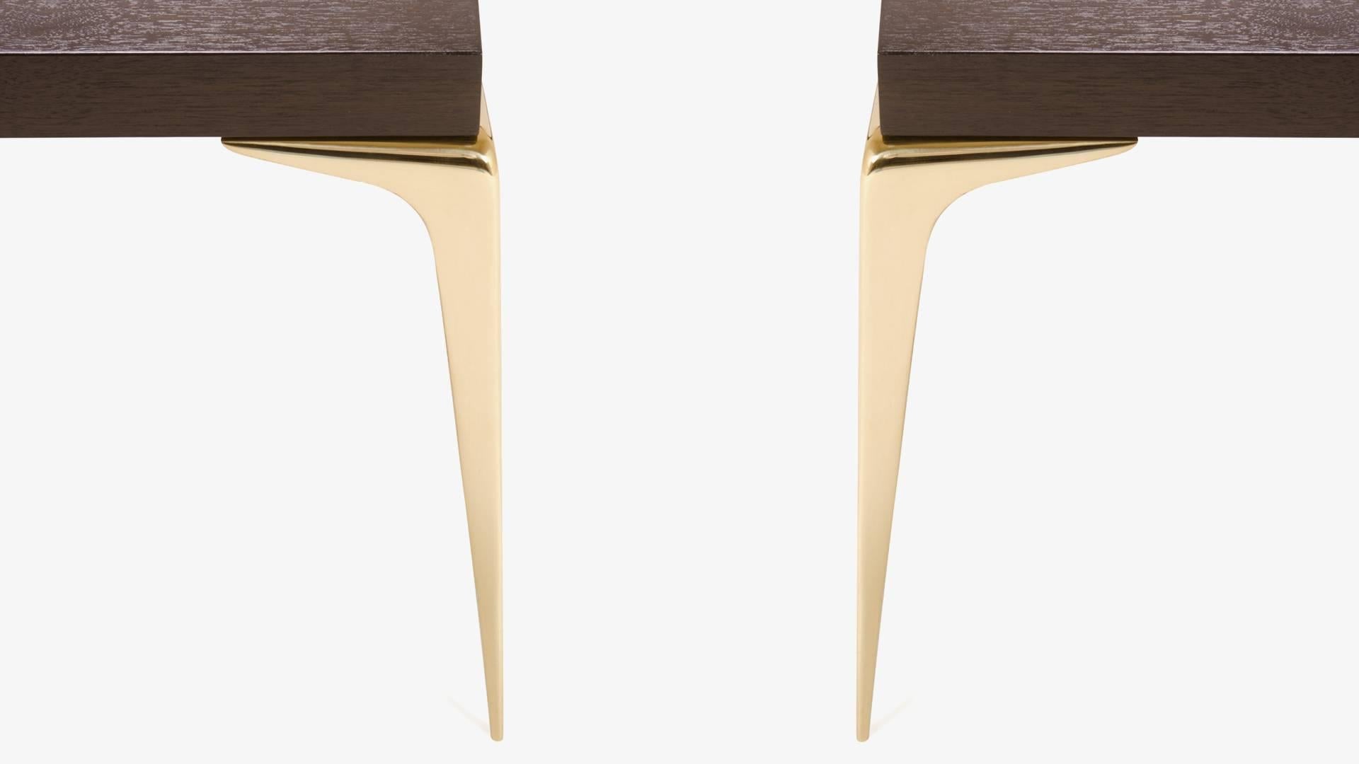 A stunning creation by Montage, the Colette occasional table. This piece was designed with the Mid-Century in mind embodying delicate proportions and bold use of the highest quality materials. 

The table is topped with solid ebonized walnut, the