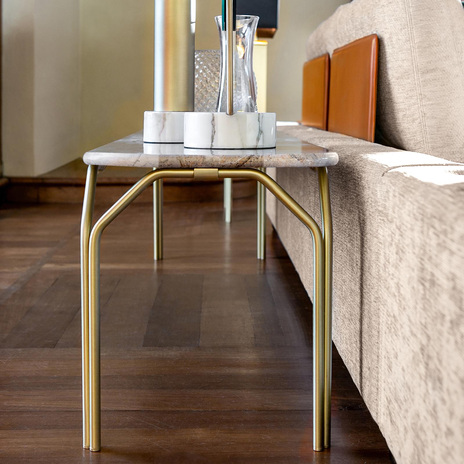 Objects with intriguing features immerse in the seasons of life that follow in succession, comforting the soul and playing notes of life. Colette Daytona console has a satin finish tubular brass structure, with marble top. Elegant and refined, it is