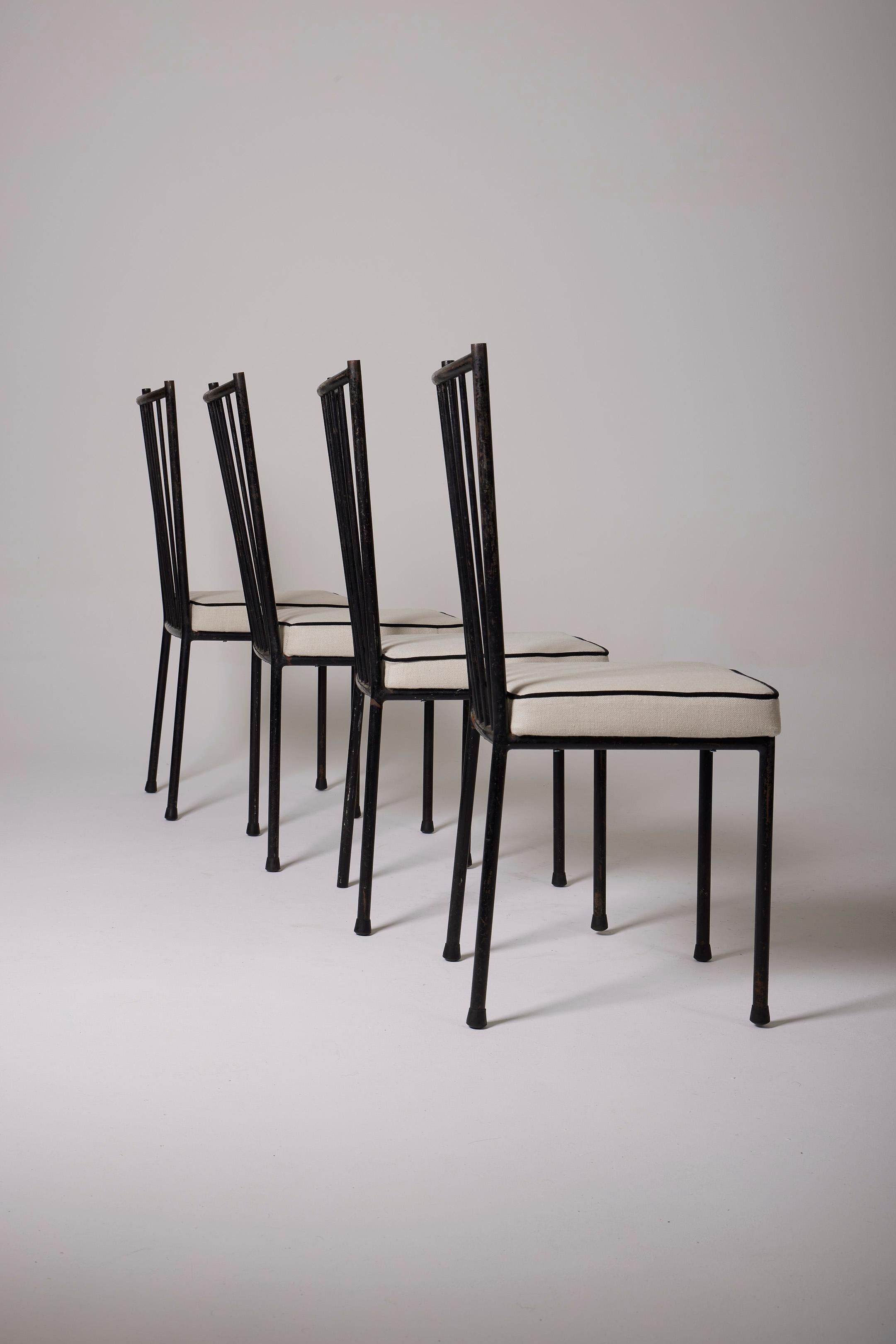  Chair by designer Colette Gueden (1905-2000) for Primavera in the 1950s (1954). The frame is in black lacquered metal and the seat is in white fabric. Signs of wear on the metal parts are to be noted (visible in the photos). Colette Gueden was a