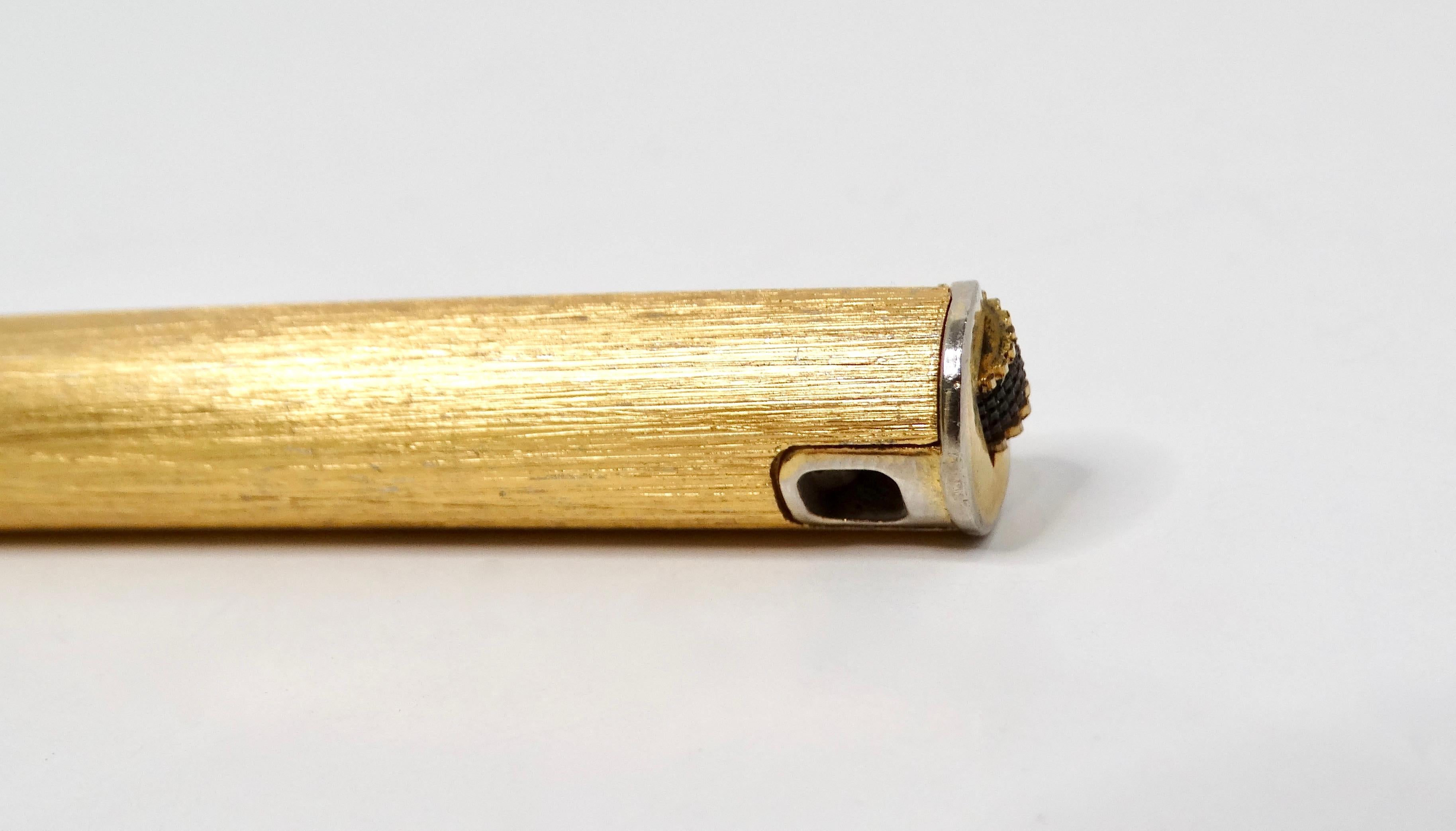 The Colibri Gold-Tone Clip Pen-Style Refillable Butane Lighter is a luxurious accessory that blends functionality with timeless elegance. Sleekly designed to resemble a classic pen, this lighter exudes sophistication and style, making it a perfect