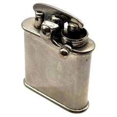 Colibri, briquet de poche à bras relevé de fabrication suisse d'origine, 1928