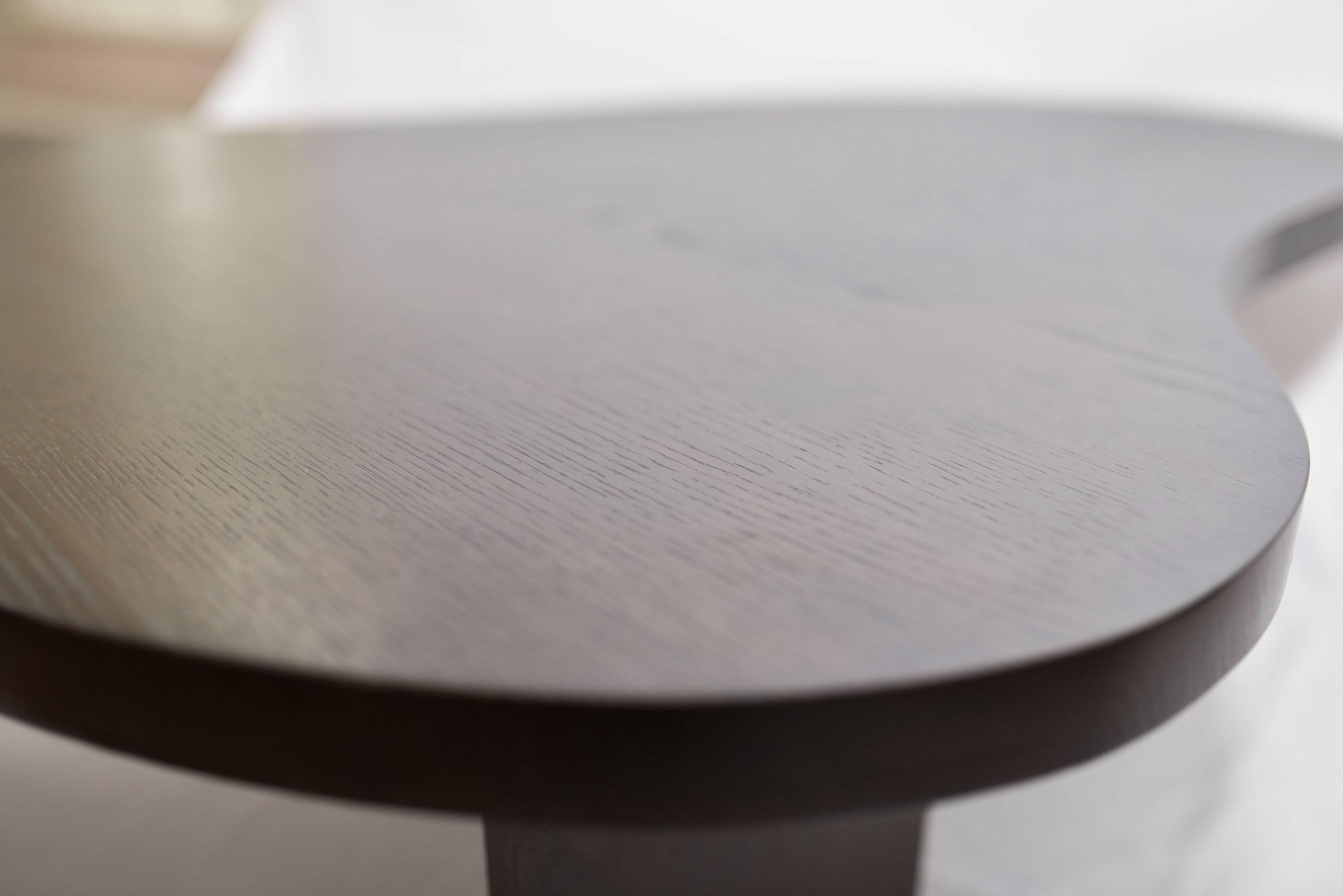 
Handcrafted in pieced solid ash, our Colin cocktail table is curvaceous, simple, and elegant. With a nod to midcentury design, yet classically updated.

A modern, curved large coffee table with a contemporary perspective.