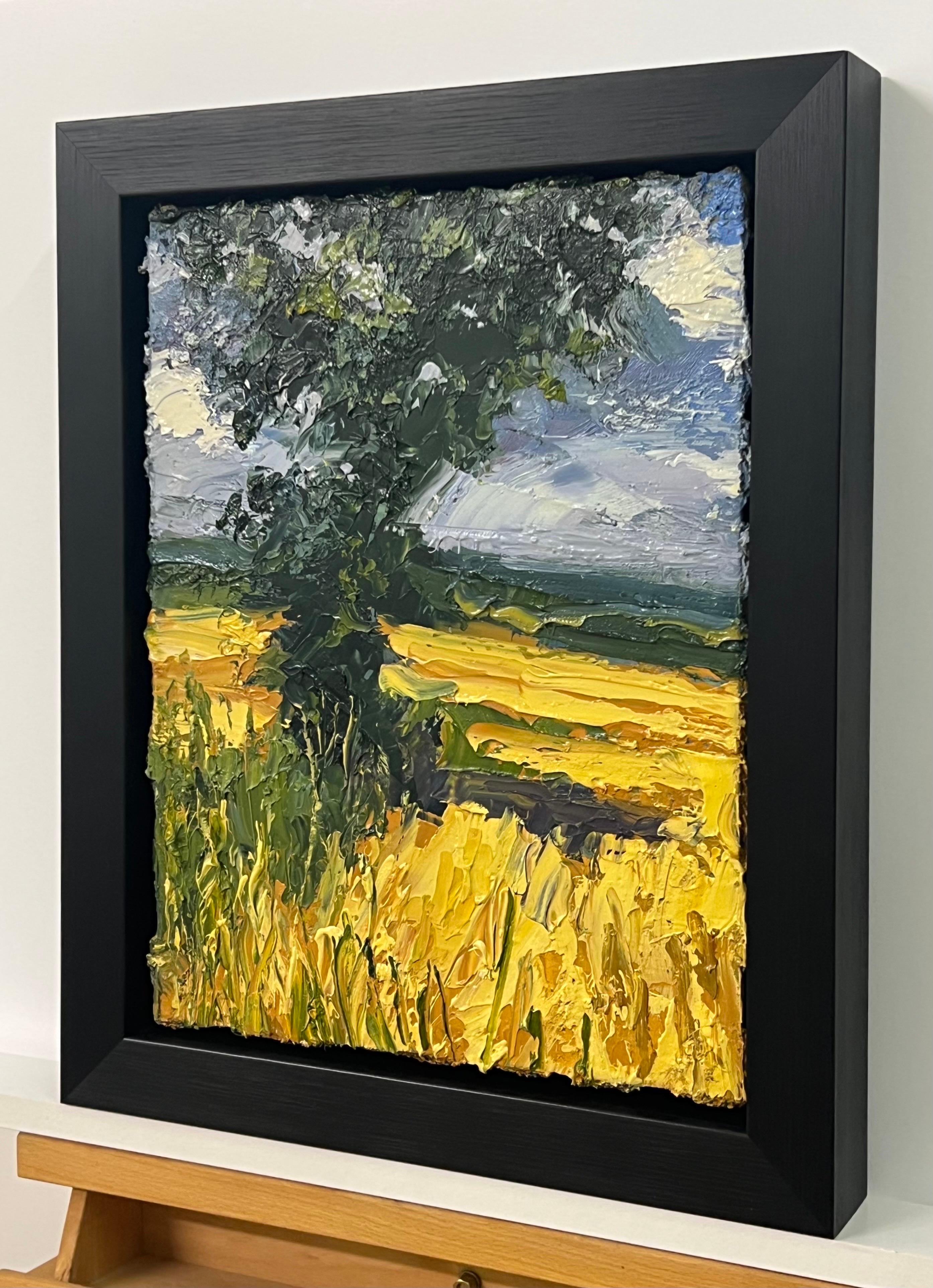 Impasto Oil Painting of Oak Tree in Yellow Corn Field in the English Countryside by British Landscape Artist, Colin Halliday. This painting articulates the intensity of the colours and irregular nature of the rustic landscape in Northern England.