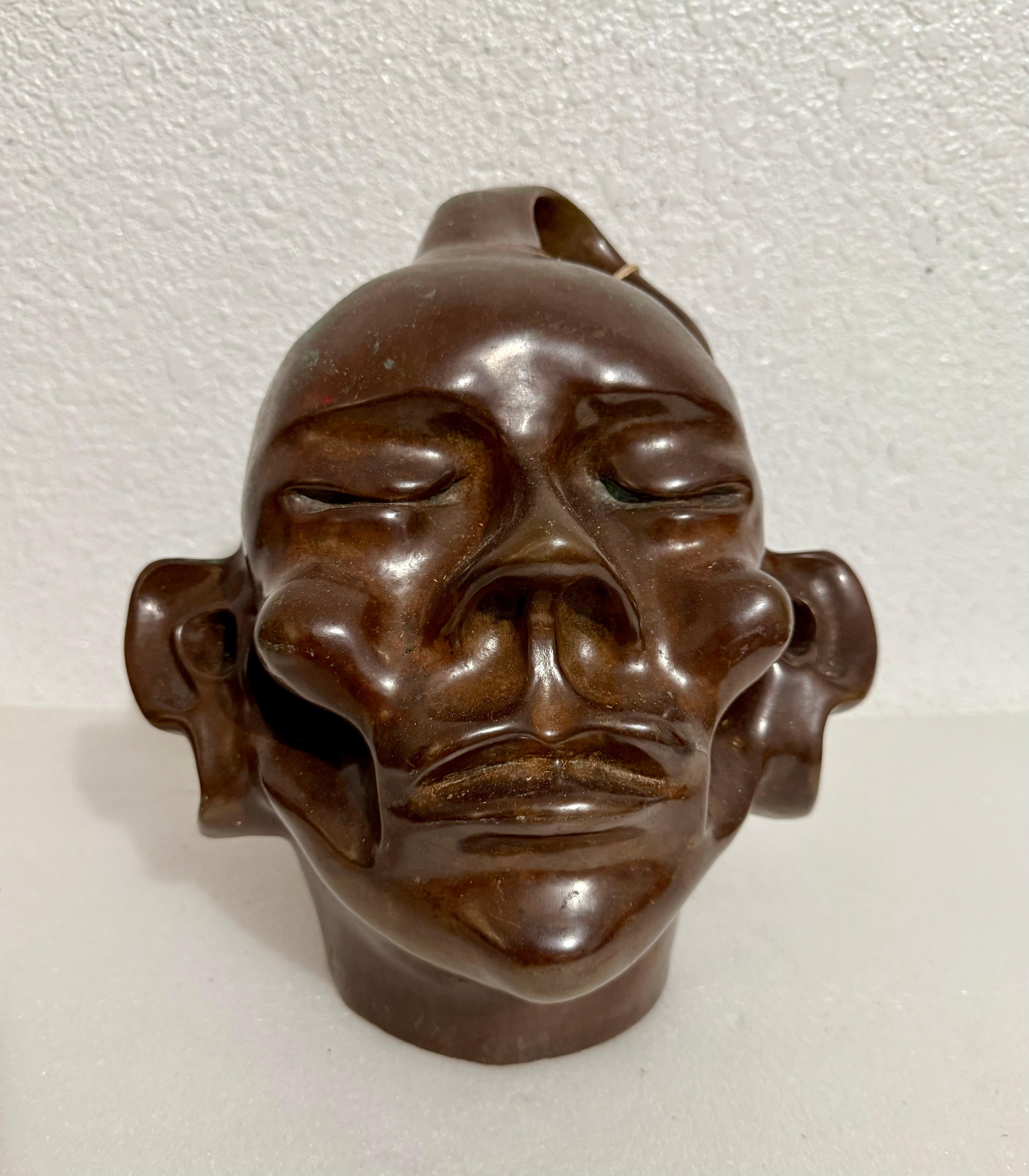 Colin Webster-Watson (1926, Palmerston North, New Zealand – 2007, Eastbourne) Sculpture portrait of a head, This appears to be a native New Zealander, A Maori Warrior. It is not numbered and might be unique. 
A wonderful abstract almost Cubist cast