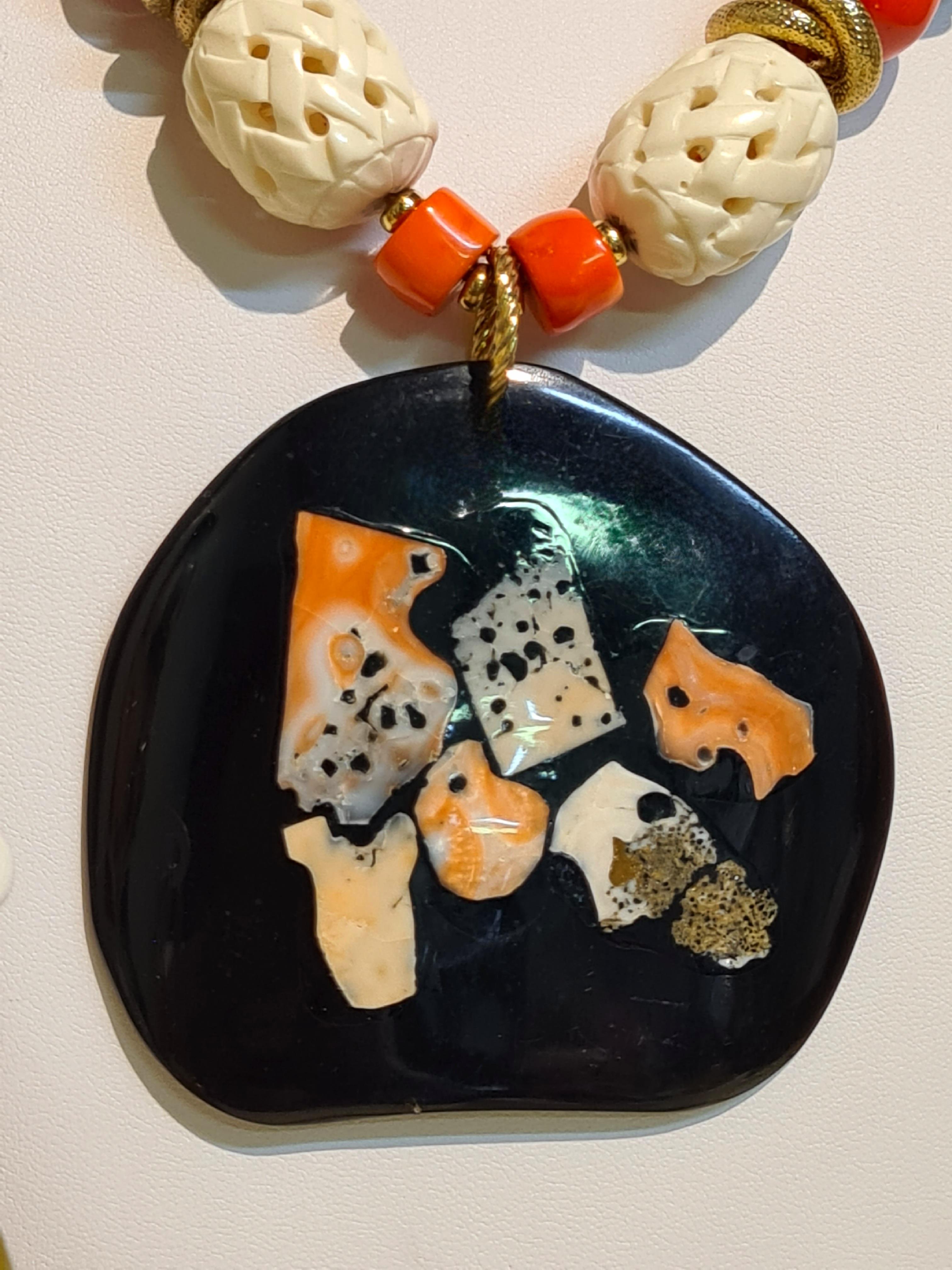 Tumbled Fantasy necklace with Horn Plate and Inlaid Coral For Sale