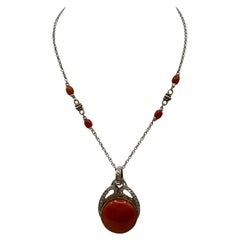 18 kt. white and yellow gold necklace with Japanese coral pendant