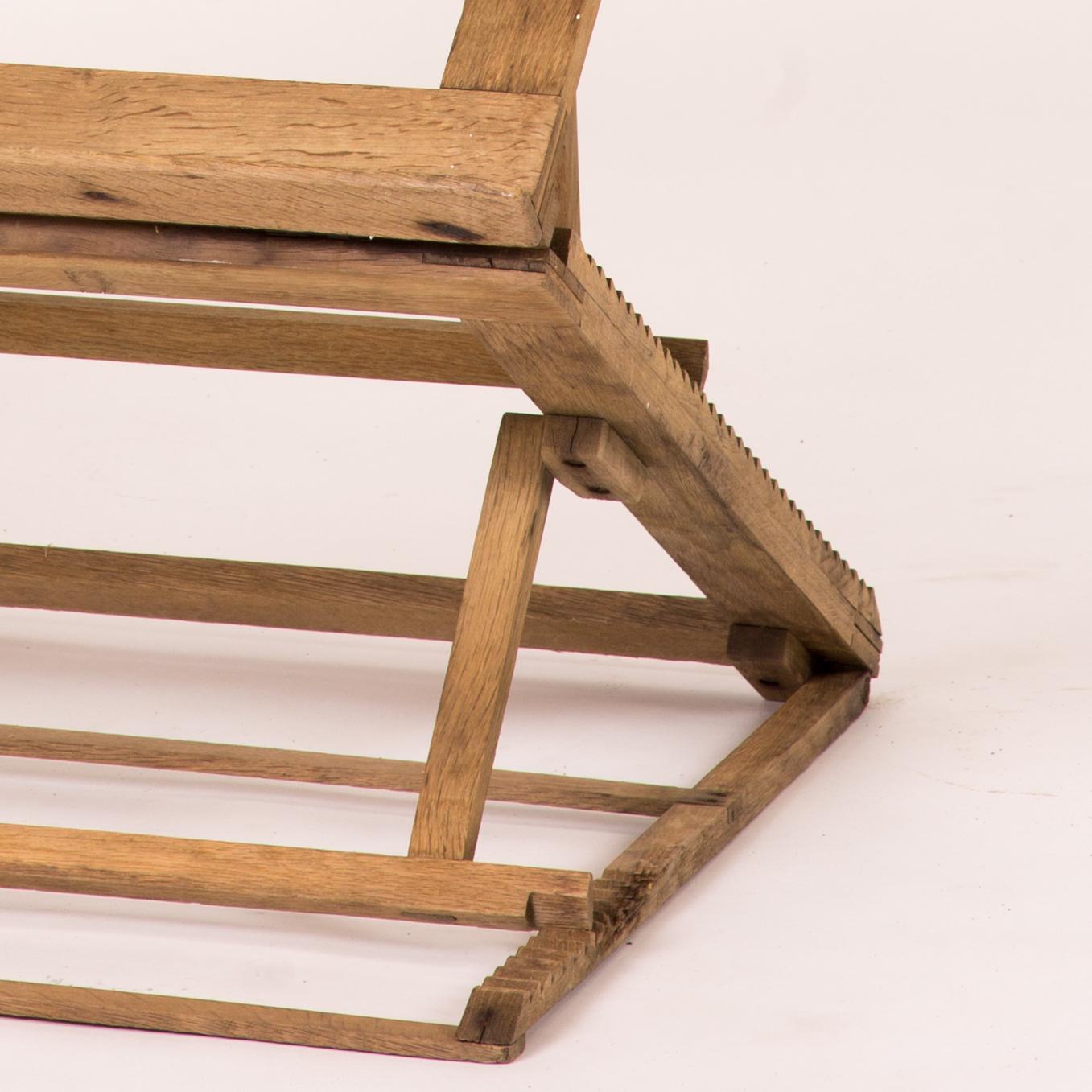 Collapsable and adjustable oak folio stand or easel from late 19th century England. 