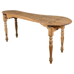 Mesa plegable de madera y hierro de una zapatería