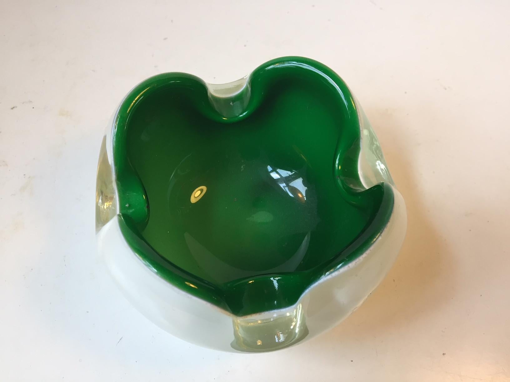 Collapsed decorative bowl or cigar ashtray composed of an exterior in opaline glass and a vibrant green interior. Made in Murano Italy during the late 1950s or early 60s.