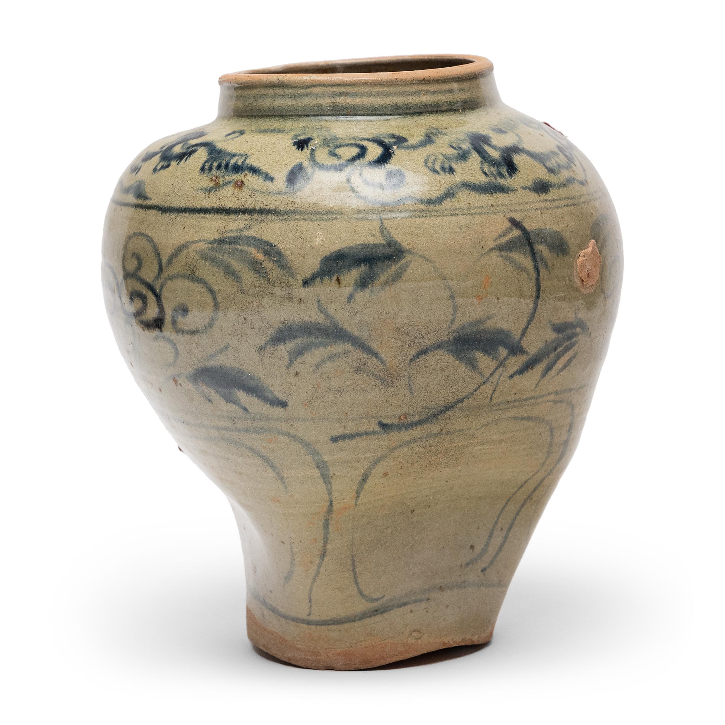 Beautiful in its imperfection, this large jar from Yunnan province has been molded by fire, the once-perfect form warped during firing for an asymmetrical silhouette. Dated to the 15th/16th century, the sculptural jar is an example of the